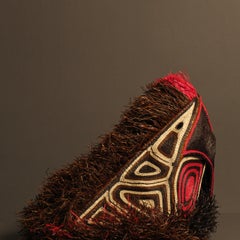 Red parrot from indigenous tribe