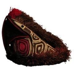Red parrot from indigenous tribe