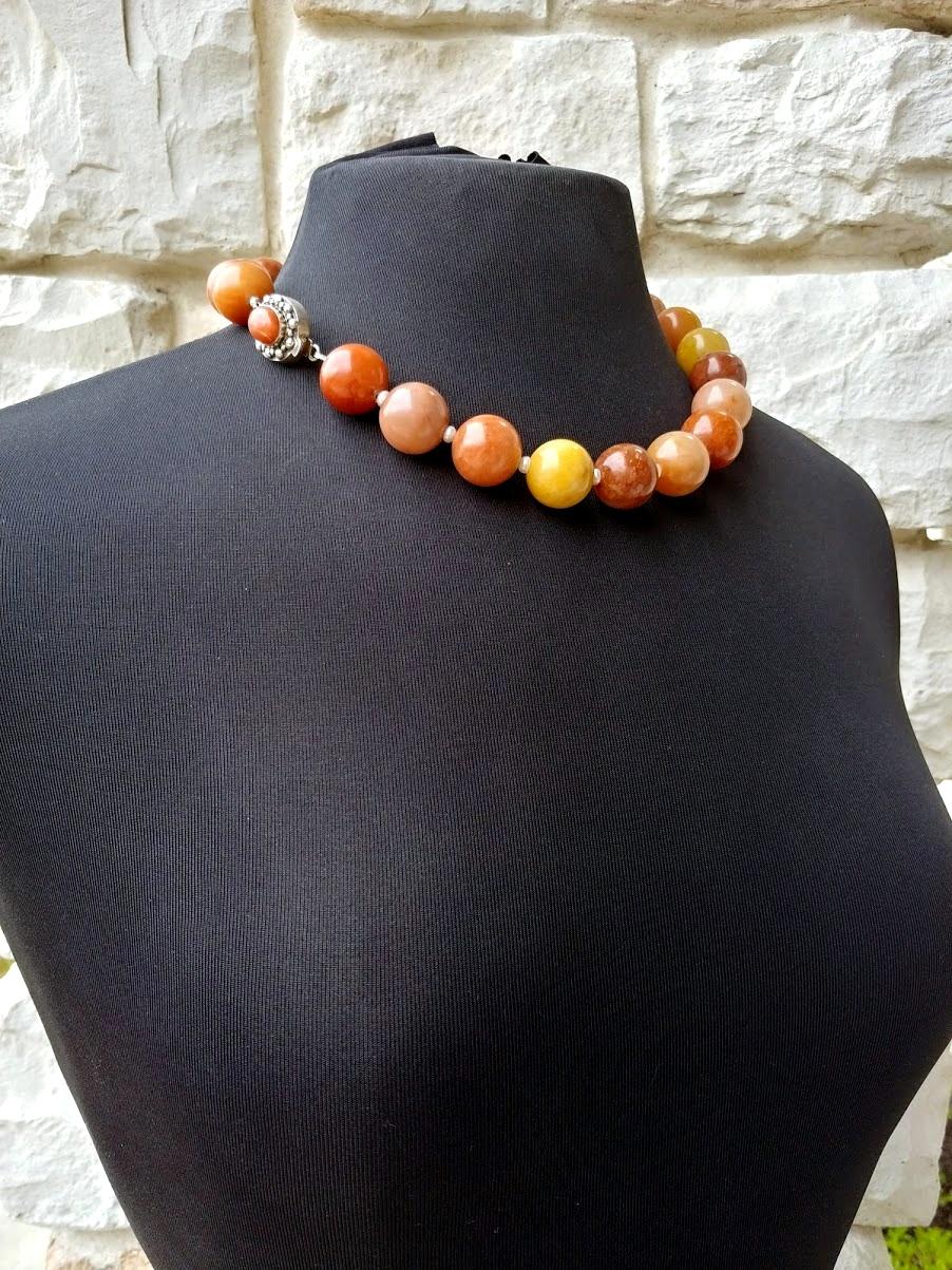 The length of the necklace is 20 inches (50 cm). The size of the smooth round beads is 18 mm.
This necklace has incredibly warm, soft, and tasty shades. It is a delicate peach color, soft beige, warm red, pale pink, and delight orange.
The color is
