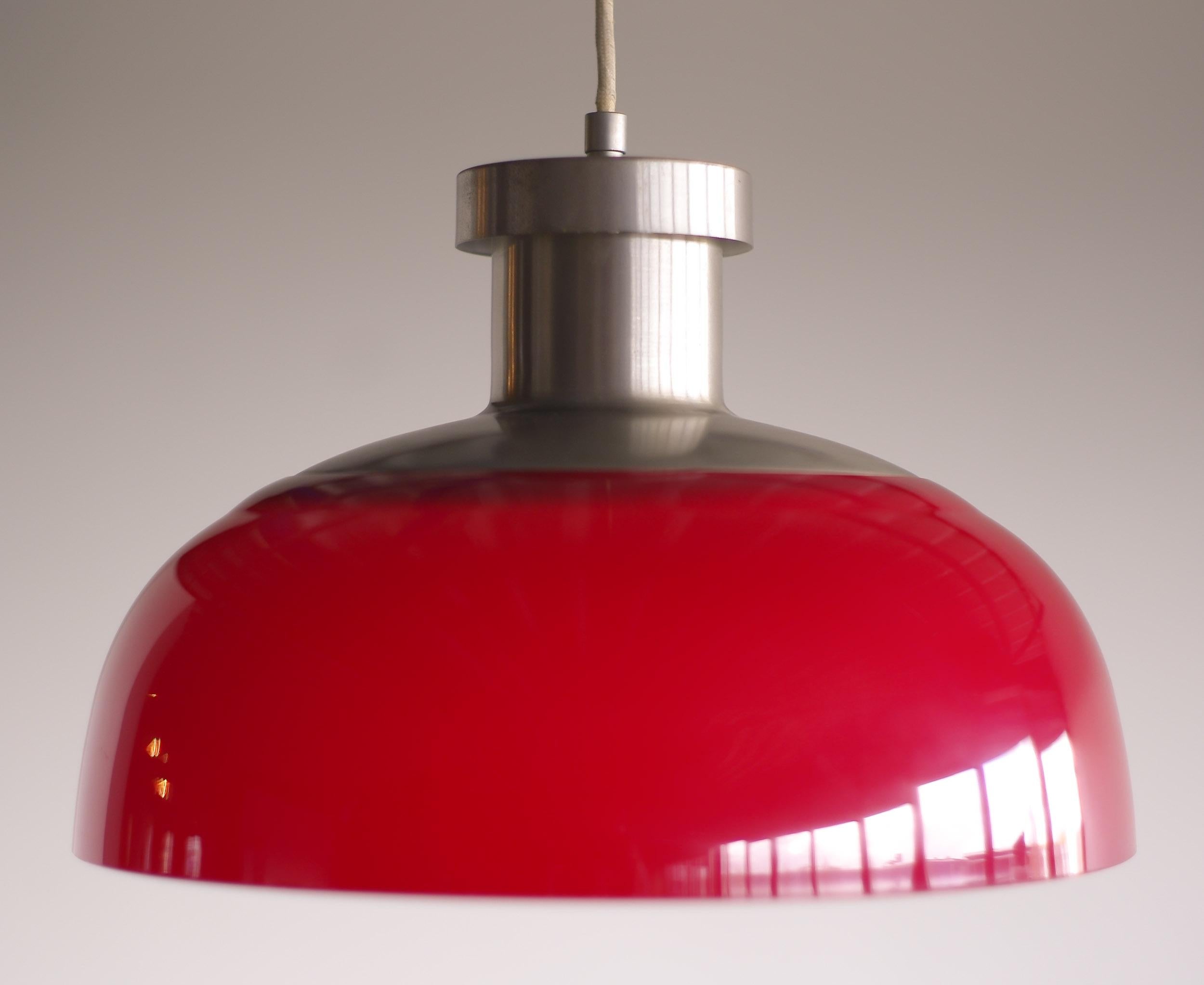 This rare pendant was the first lighting design by Achille Castiglioni.
Made of nickel-plated steel with an acrylic shade this light looks very contemporary, but it is vintage Mid-Century Modern.
