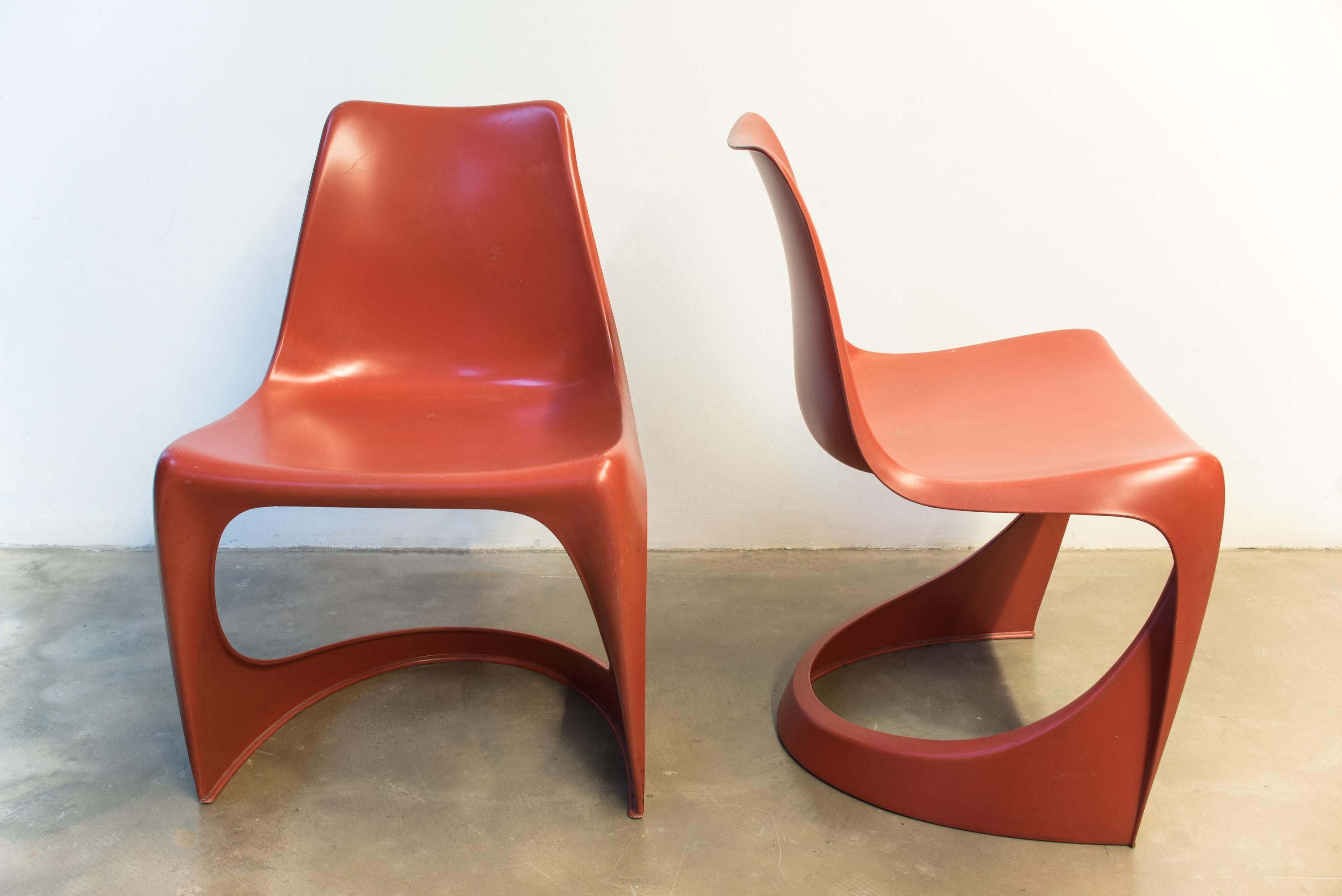 Red plastic chairs by Steen Ostergaard by Cado, model 290, Denmark, 1968.
Indoor/Outdoor stacking dining chairs.