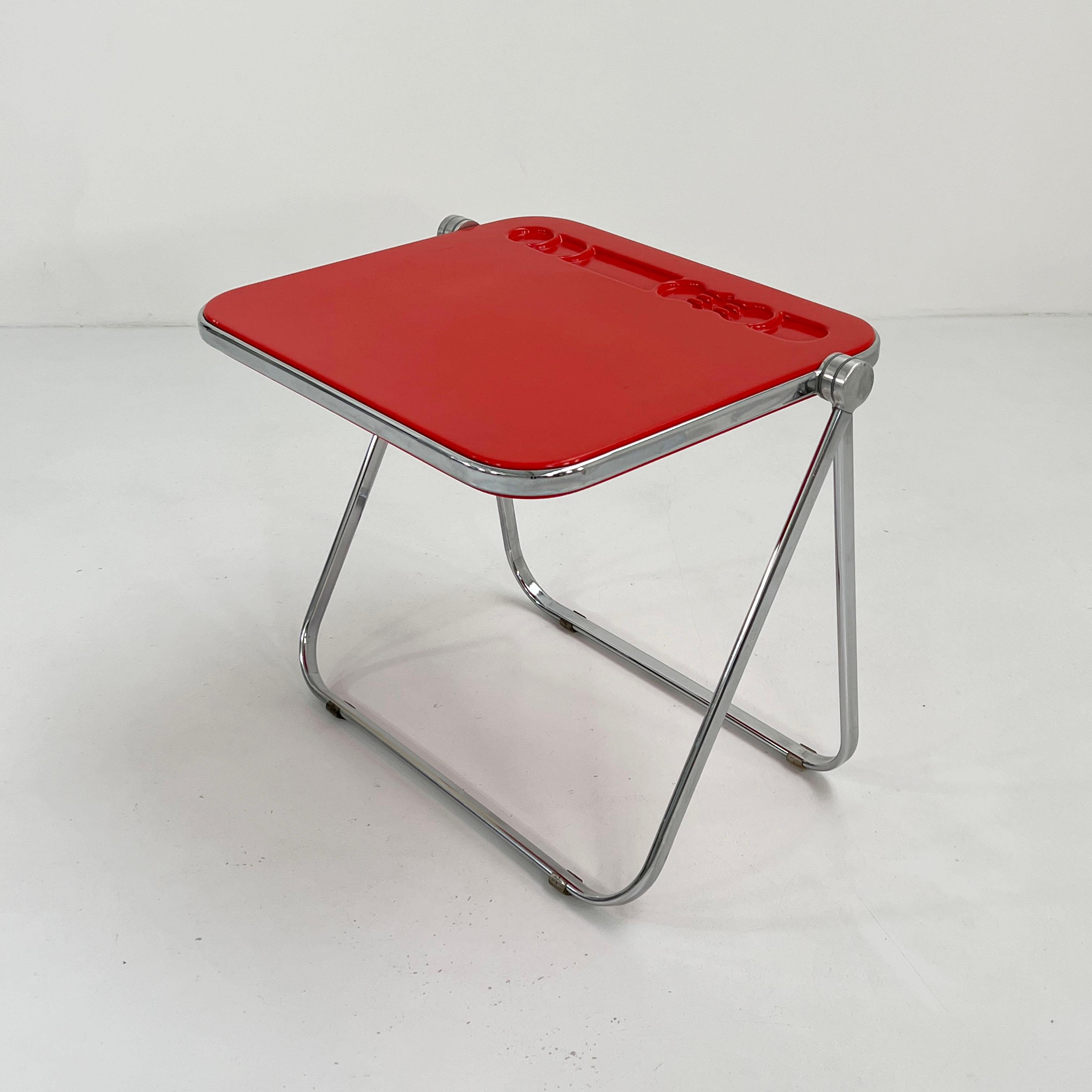 Designer - Giancarlo Piretti
Producer - Anonima Castelli
Model - Platone Folding Desk 
Design Period - Seventies
Measurements - Width 82 cm x Depth 65 cm x Height 70 cm
Materials - Perspex, Steel
Color - Red, Silver
Light wear consistent with age