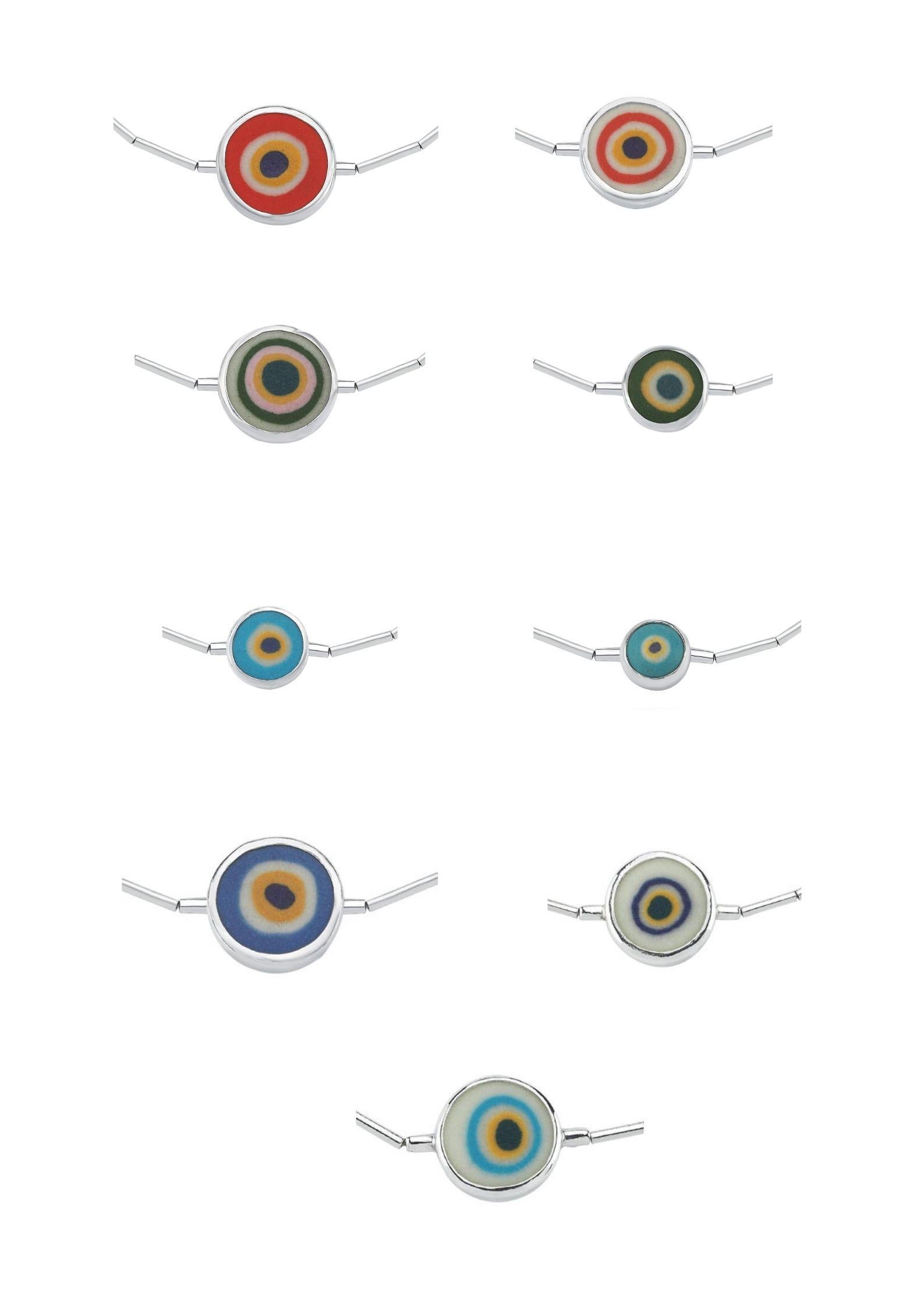 Evil Eye Bead made from porcelain. Sterling Silver. You can choose this design as a bracelet or necklace. Feel free to contact us.
Other color options are blue, green, orange, turquoise. We also have different shapes. Do not hesisate to ask your
