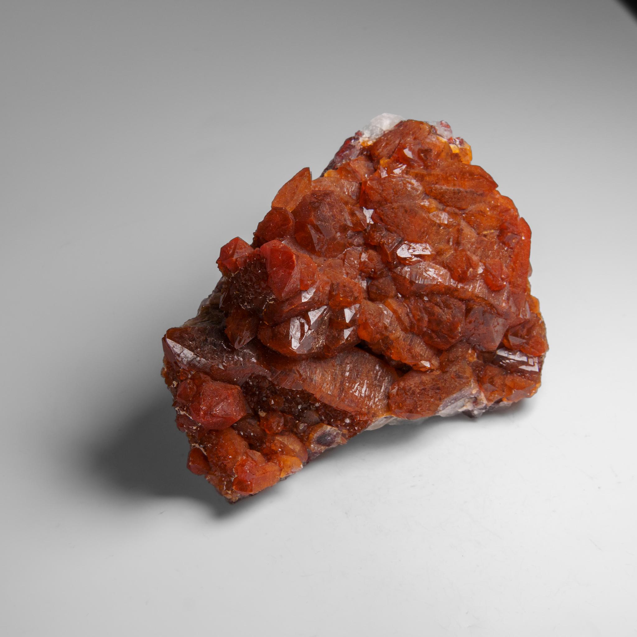 Red Quartz Hematite crystal cluster from Izizauen Alnif, Tarhbalt, Morocco. Cylindrical stalactite of calcite crystals mixed with red hematite.

Hematoid Quartz contains both the amplification properties of Quartz with the balance and stability of