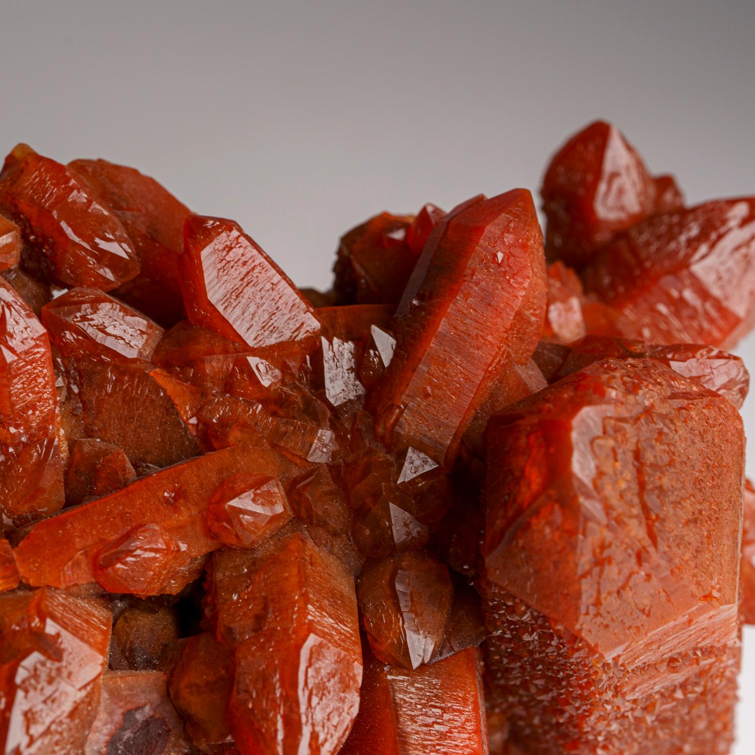 Red Quartz Hematite crystal cluster from Izizauen Alnif, Tarhbalt, Morocco. Cylindrical stalactite of calcite crystals mixed with red hematite.

Hematoid Quartz contains both the amplification properties of Quartz with the balance and stability of