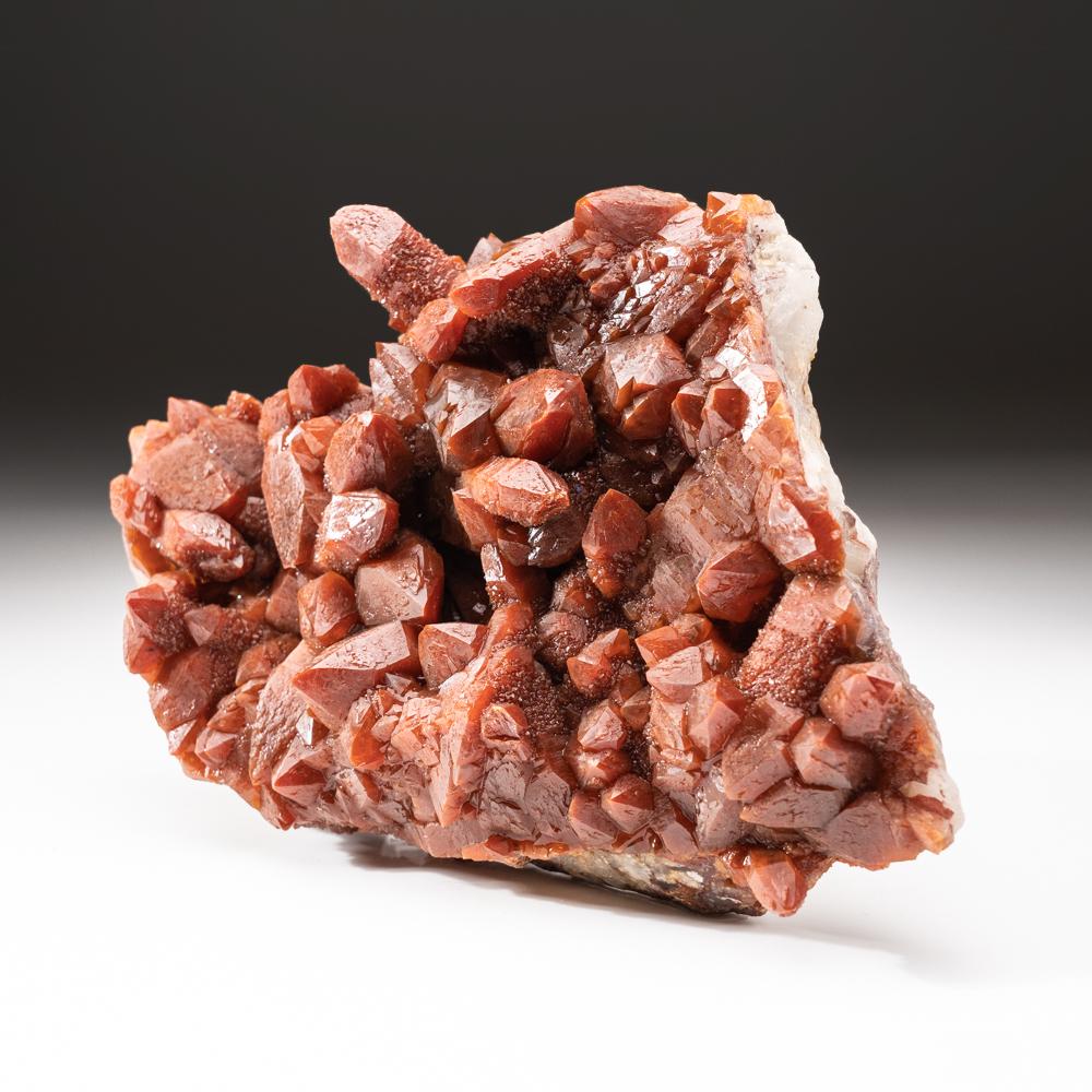 Red Quartz Hematite crystal cluster from Izizauen Alnif, Tarhbalt, Morocco.

New 2014 find of lustrous brick red hematite included quartz crystal cluster coated with second generation red quartz with a glassy luster. Very aesthetic formation, fully