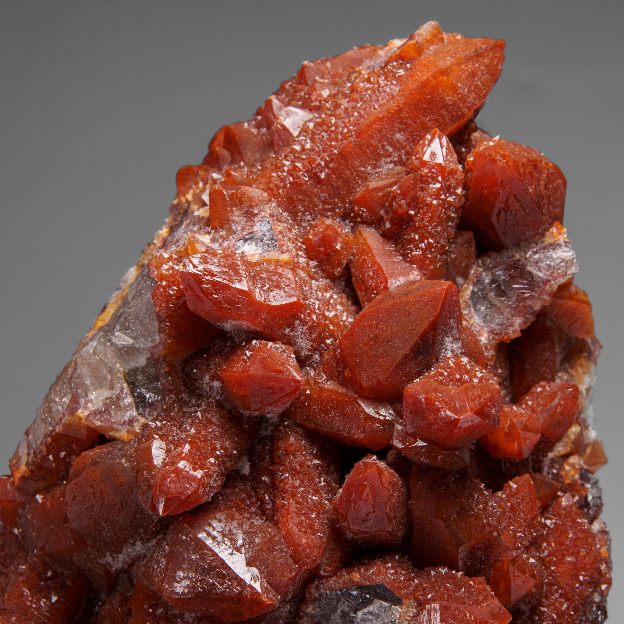 Red Quartz Hematite crystal cluster from Izizauen Alnif, Tarhbalt, Morocco. Cylindrical stalactite of calcite crystals mixed with red hematite.

Hematoid Quartz contains both the amplification properties of Quartz with the balance and stability of