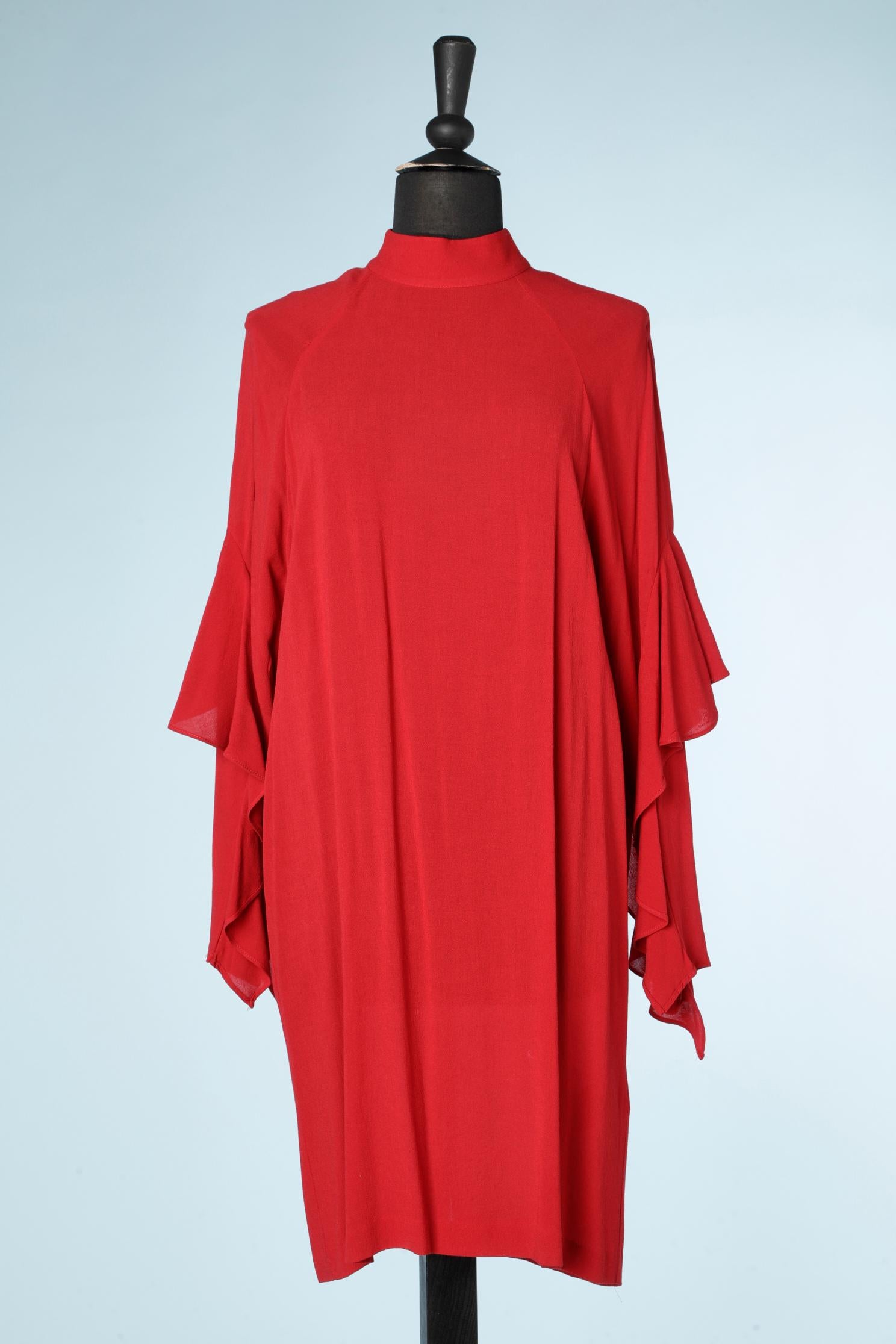 Red rayon cocktail dress with ruffles on the sleeves and raglan sleeves.
Button in the top middle back and buttonhole. One extra button provided. 
SIZE L 