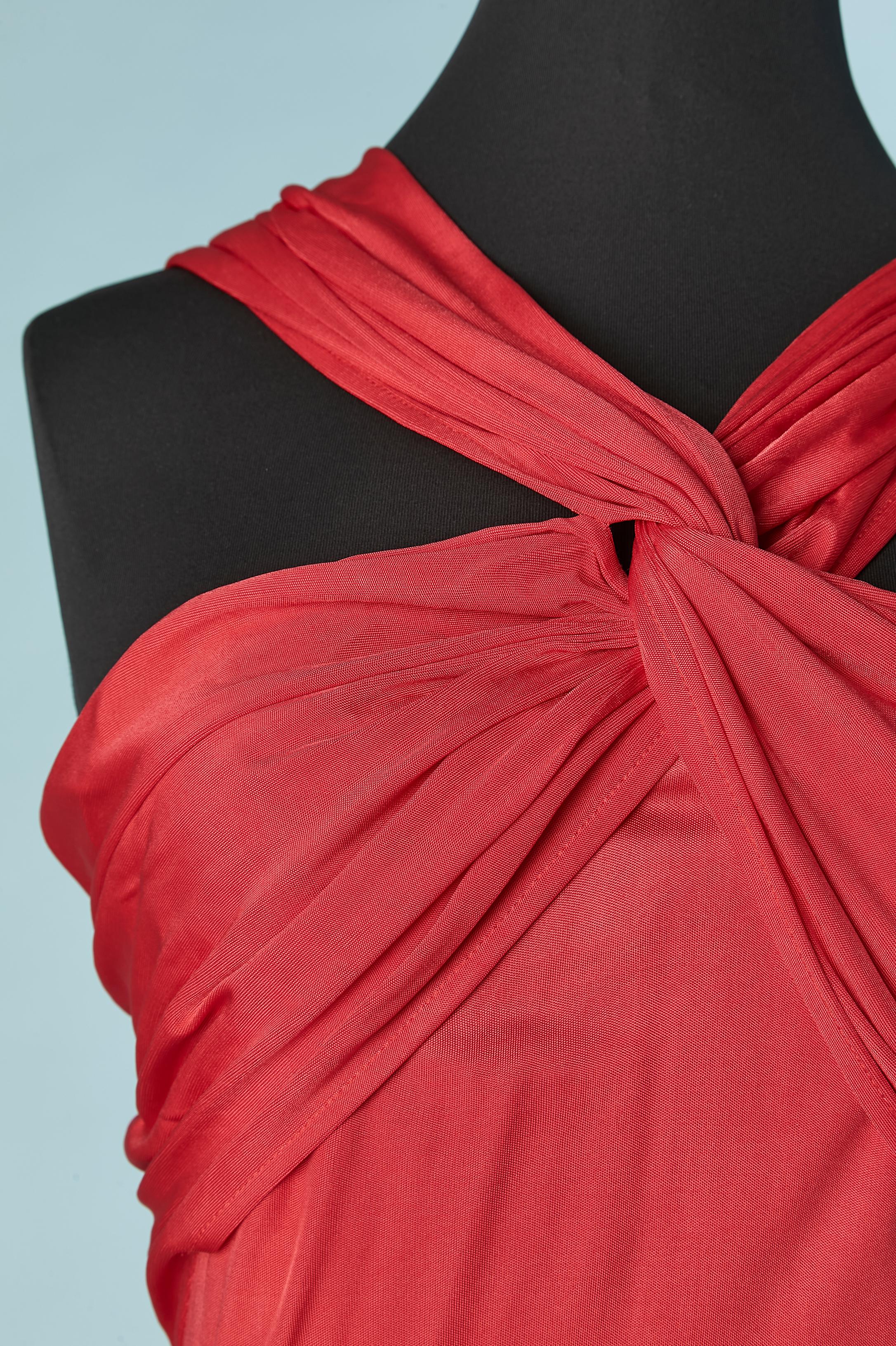 Red rayon jersey evening dress draped on the bust and back . Body Lining: 100% polyester. 
Invisible zip and hook&eye closure in the middle back. Cut-work. Silicone strap inside the bust on the top edge. Split on the side 
 middle front= 60 cm.