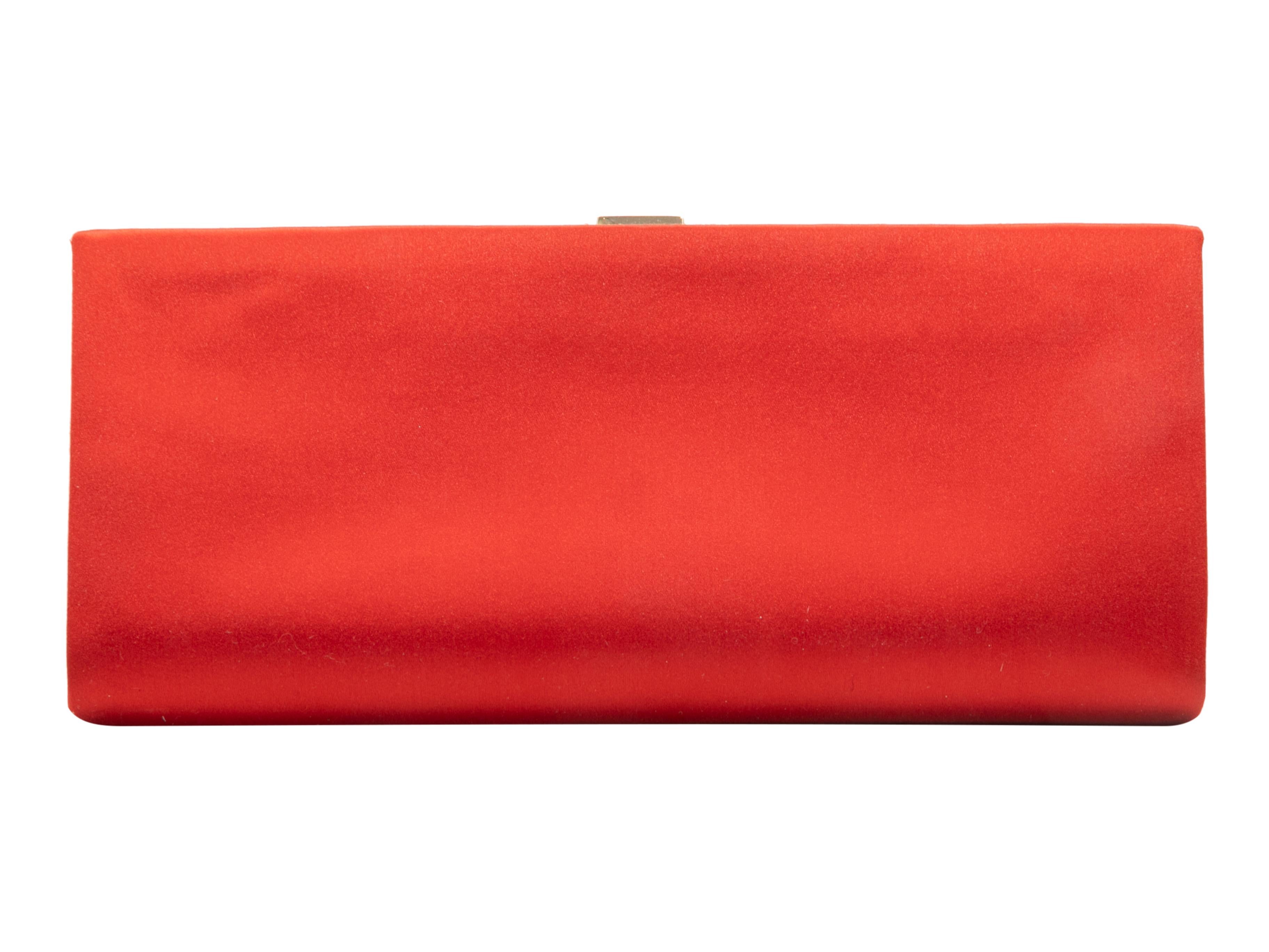 Red Roger Vivier Satin Clutch. This clutch features a satin body, gold-tone hardware, and a jewel-embellished top clasp closure. 10.75