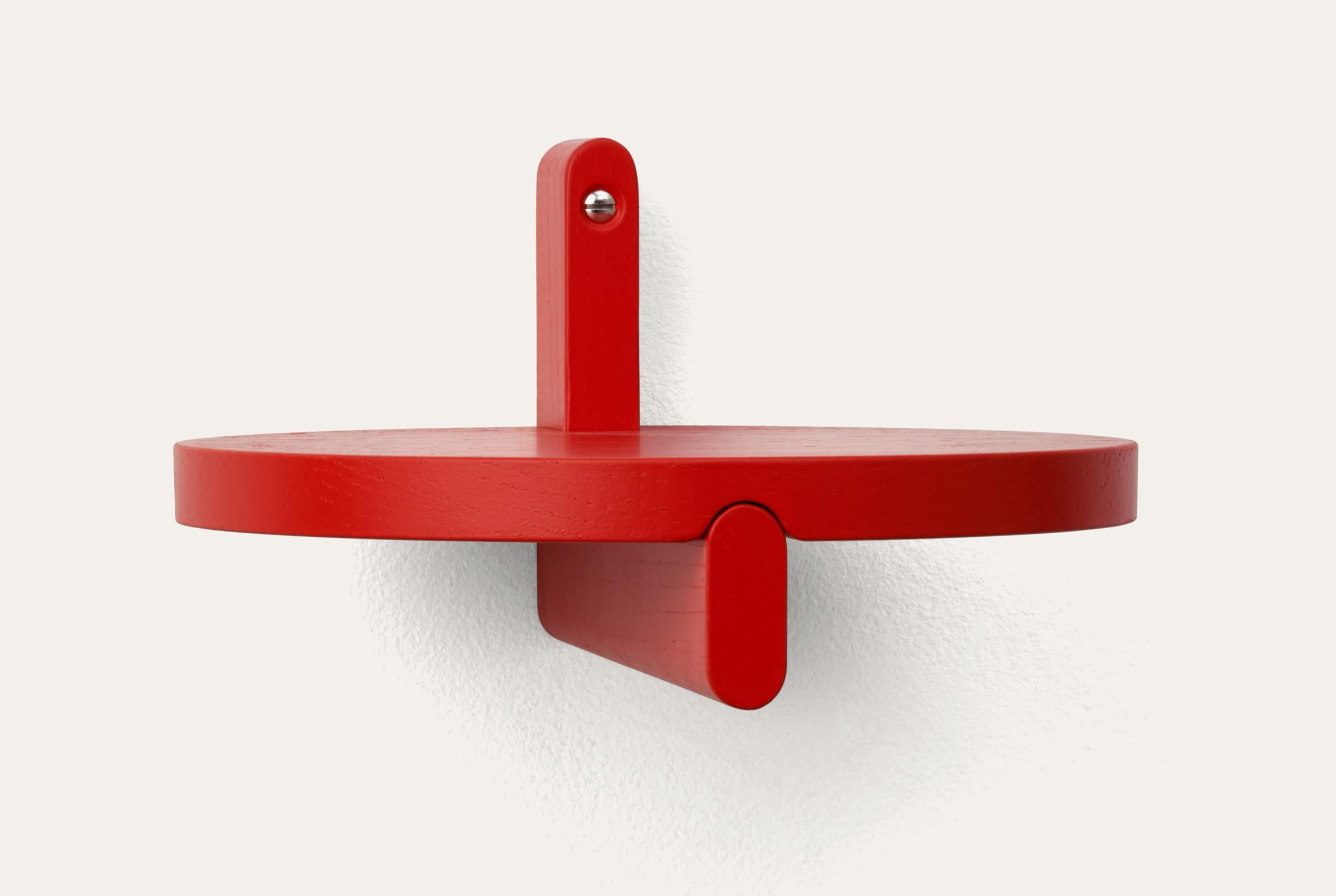 Red Rondelle round shelf by Storängen Design
Dimensions: D 25 x H 14 cm
Materials: oak wood.
Available in other colors and with or without steel hanger.

Rondelle can be a shelf or a small table depending on your needs. It shares the same