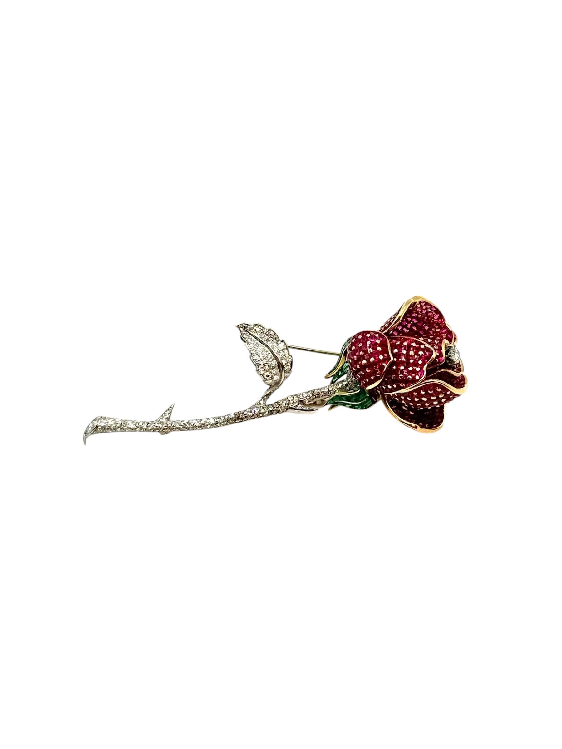 Flower brooch in the form of a rose, platinum, and gold with rubies, diamonds, and emeralds, circa 1940.