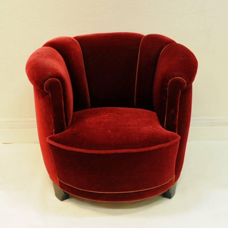 Nice and comfortable round armchair in beautiful deep red color. Fabric: velour. The chair has wooden legs and is from around the 1930s, Denmark. Round interesting shape. Measures: 71 cm H, 81 cm W, 81 cm D, 40 cm seat height and depth of seat is 58