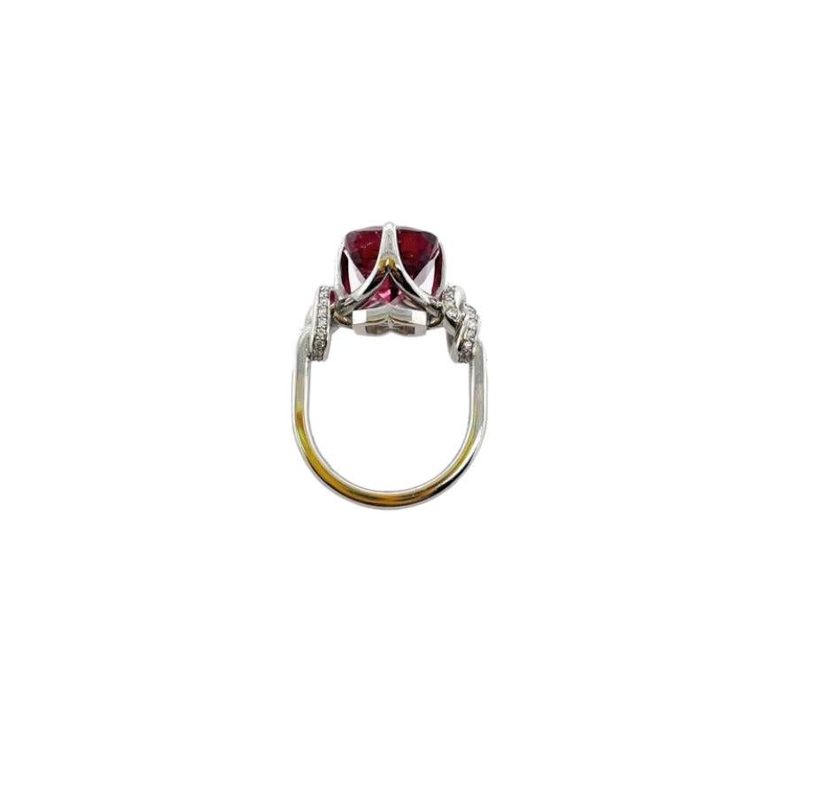 Glamorously bold and unabashedly seductive. This showstopper ring features an extraordinarily red Rubellite tourmaline embraced North, South, East, West by gorgeously gold talons and powerful-platinum, diamond encrusted ropes.

 Platinum 

High
