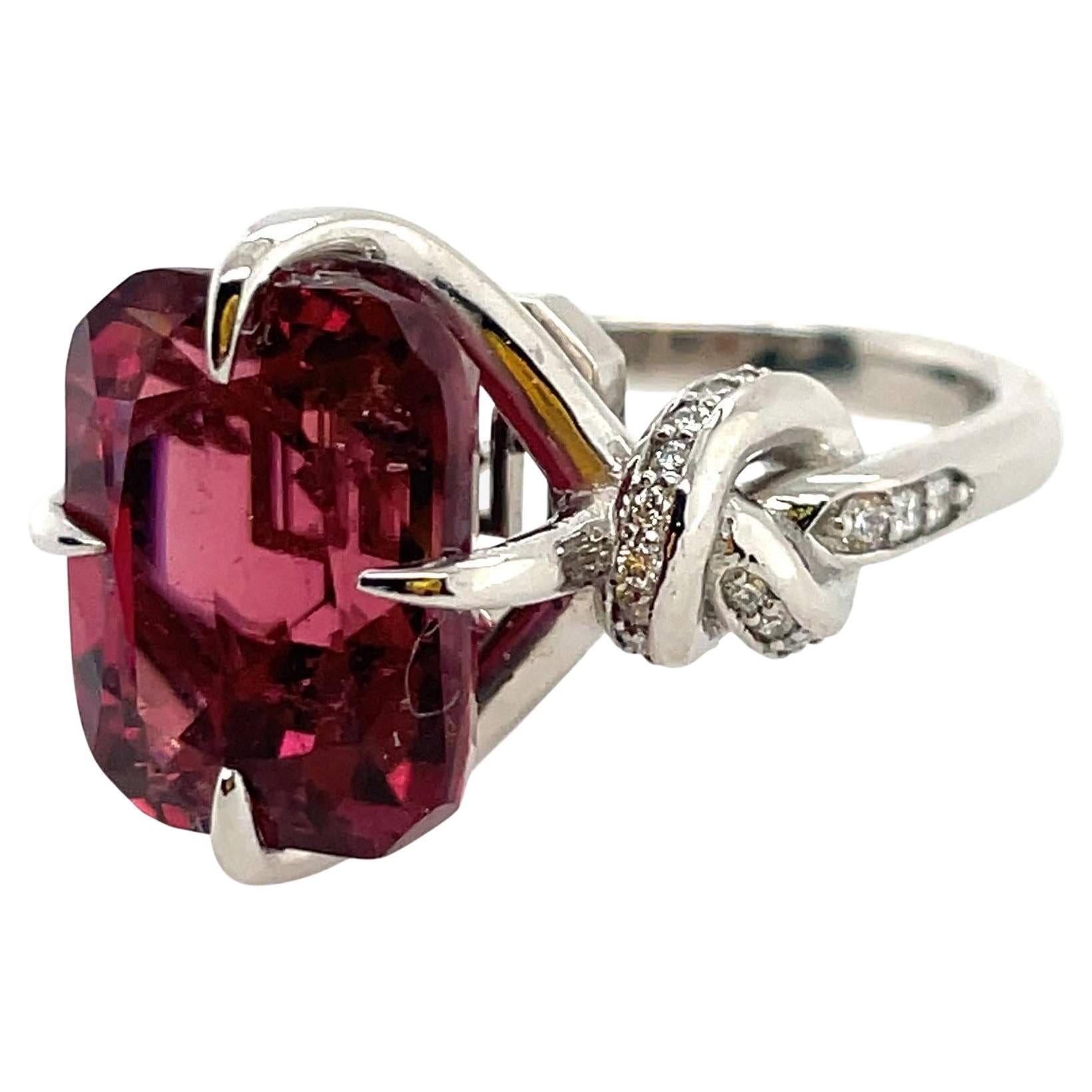 Glamorously bold and unabashedly seductive. This showstopper ring features an extraordinarily red Rubellite tourmaline embraced North, South, East, West by gorgeously gold talons and powerful-platinum, diamond encrusted ropes.

 Platinum 

High