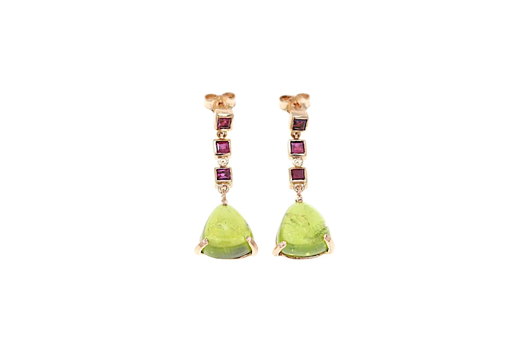 Handmade earrings in 9k rose gold crafted in our Milan jewelry workshop with 6 square cut rubies total 0.90 ctw and 2 cabochon cut peridot 0.47 inches total 4.0 ctw. The lenght of each earrings is: 1.29 inches. Marked with 9 carat gold mark and