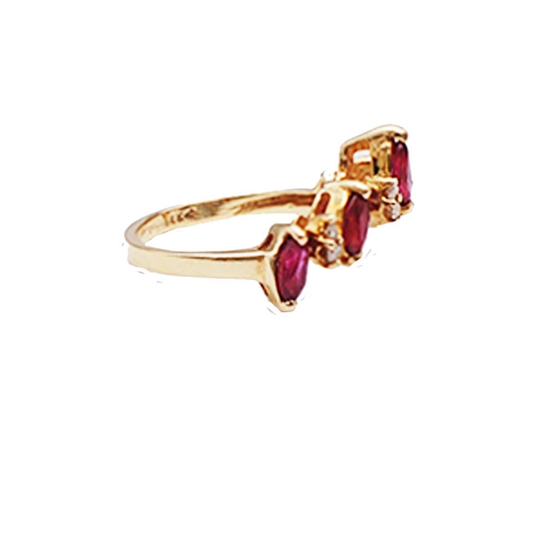 Ruby and Diamond 'V' Shaped Ring set in 14 Karat Yellow Gold 
The ring is accented with alternating marquise red rubies with diamonds. 
A total of (5) Rubies are  approximately .50 carat and (8) round diamonds are .12 carat total weight. Quality of