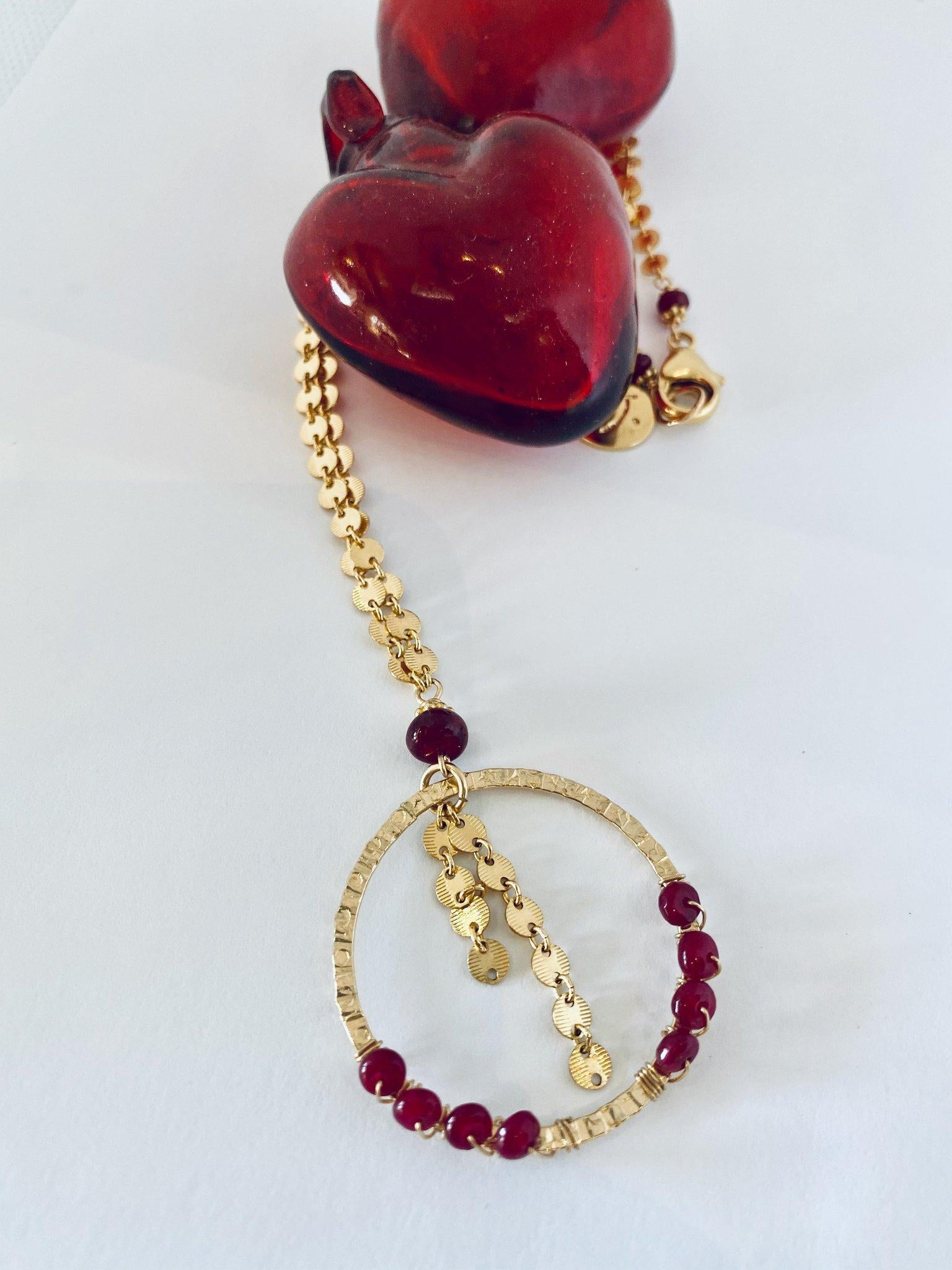 Story Behind the Jewelry
The 14K gold ruby necklace was designed with circles, which are a universal symbol for endless meaning.  We have used circles in our Valentine's Collection as a symbol of endless love.  Our collection represents all types of