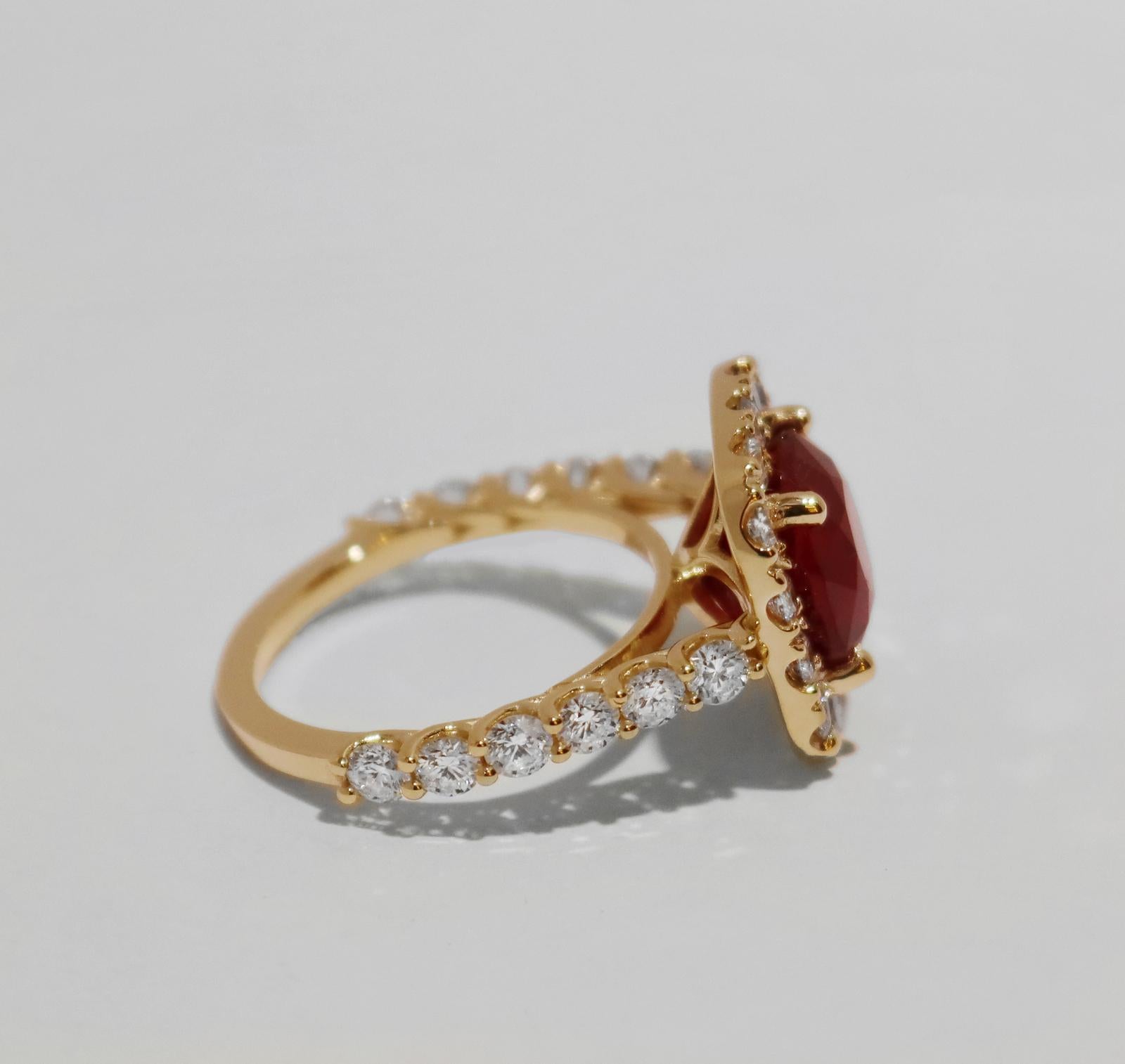 RED RUBY RING WITH DIAMONDS IN YELLOW GOLD 

14k yellow gold
Ring size: 8
Sapphire: 5.45ct, 10x10mm
Diamonds: 2.3ct, VS clarity, E-F color

Retail: $7,500