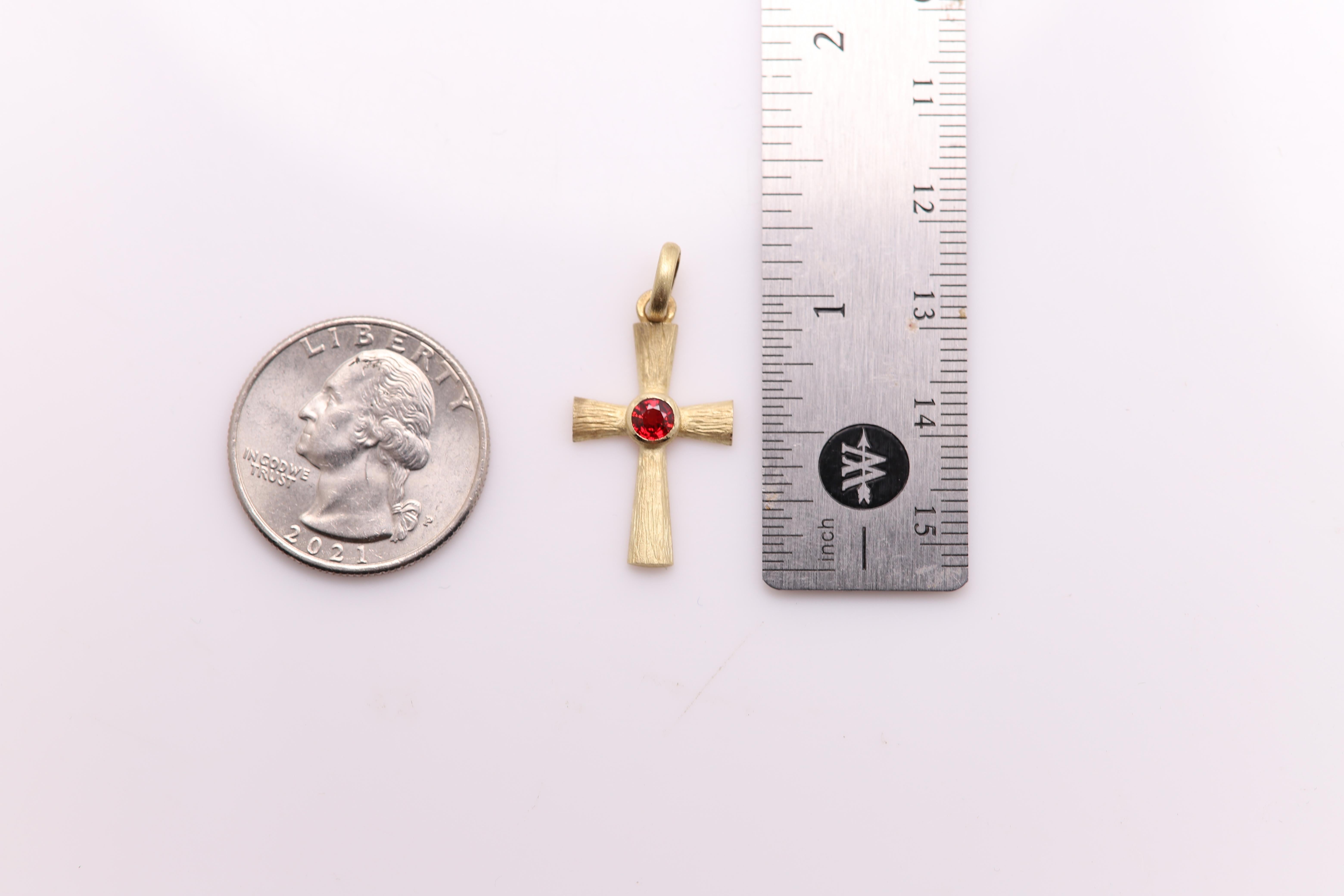 Brilliant Cross Pendant
Somewhat vintage about 20 years old - new, never used
Set in 14k yellow gold 1.70 gram - brushed finish (solid gold)
Approx size 25 mm high ( 1' inch)
Natural Red Sapphire 4.0mm(approx 0.35 carat)
Hand Made in Italy  
Gift