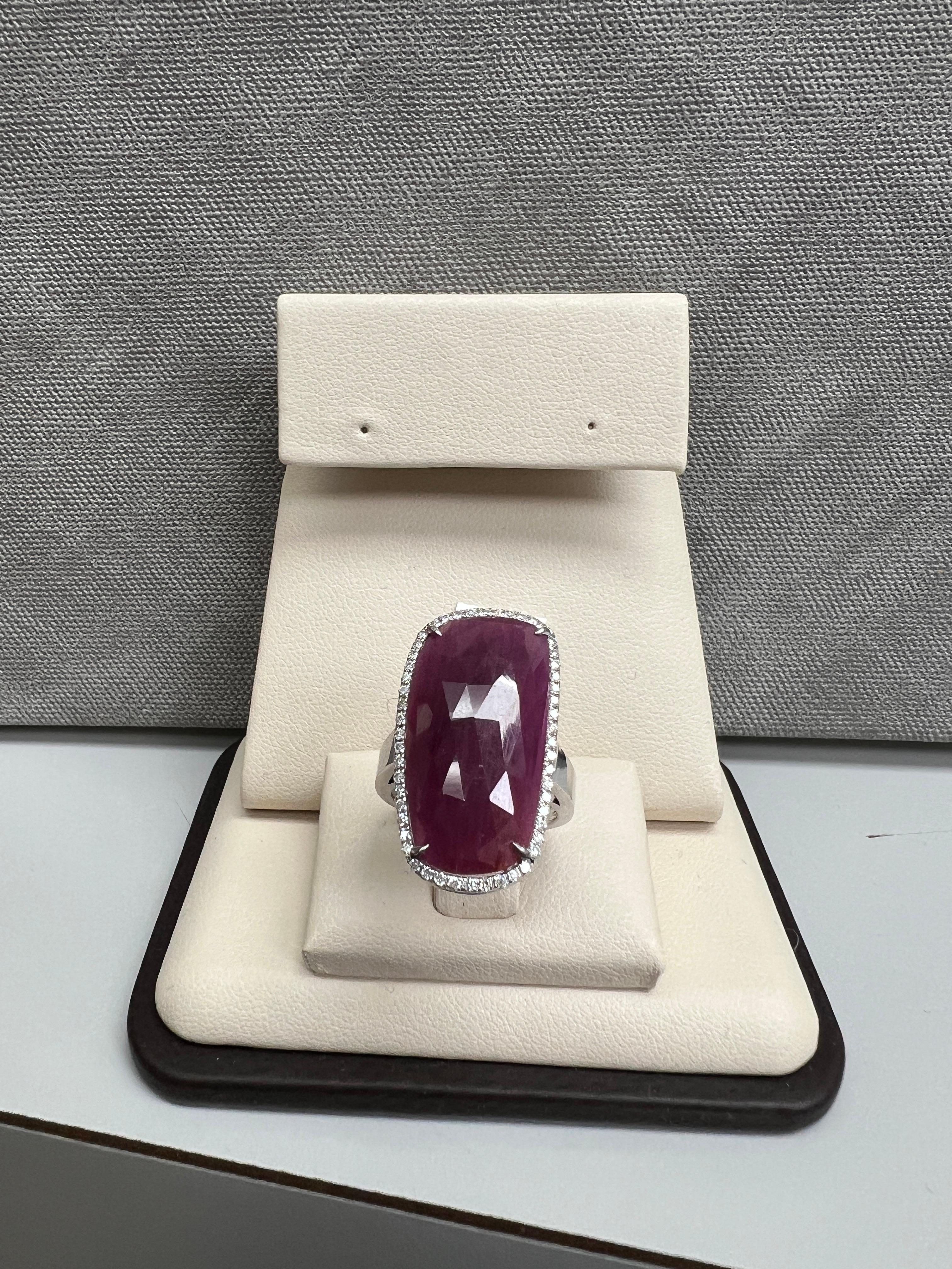 This 14K White Gold Gorgeous Red Sapphire Slice Ring with Diamonds is a timelessly beautiful ring that will make a statement. The ring is made of white gold and features a Natural red sapphire Slice, surrounded by Vivid Natural white diamonds. This