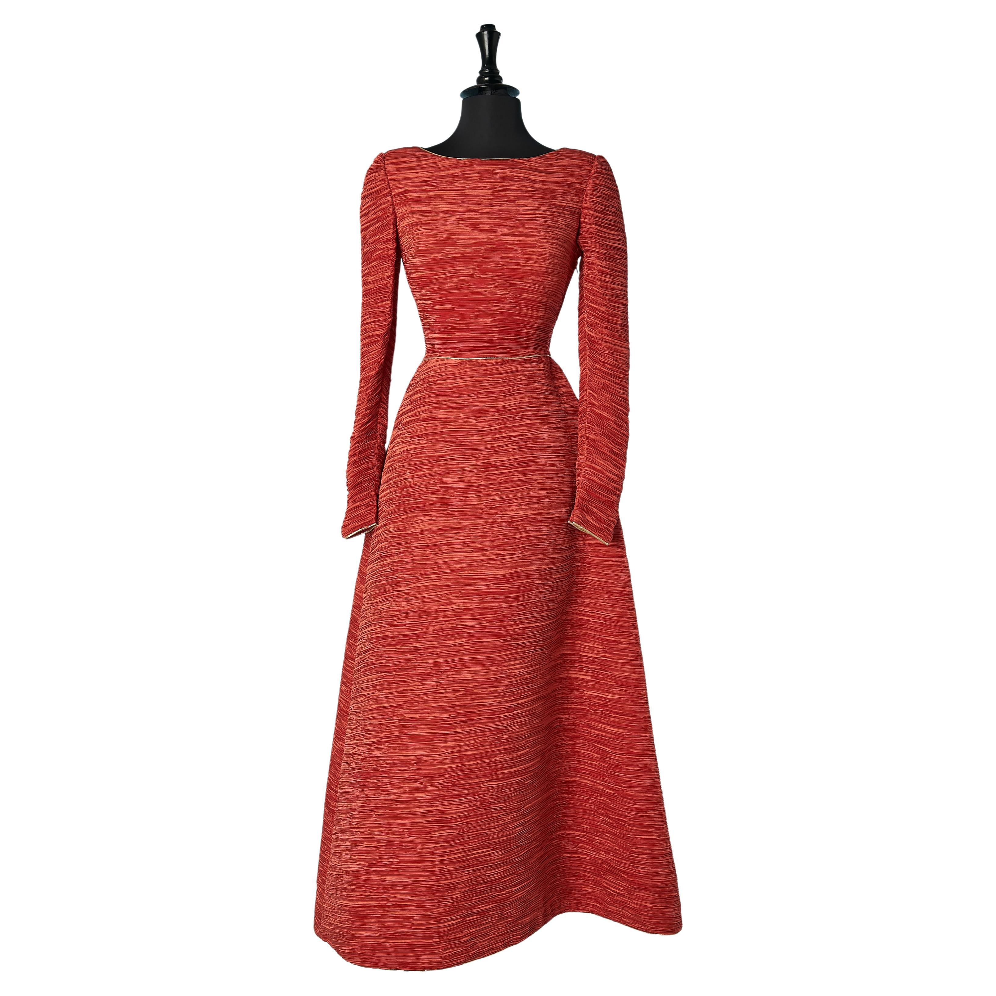 Red satin evening dress with thin pleats and gold lamé piping Circa 1970's  For Sale