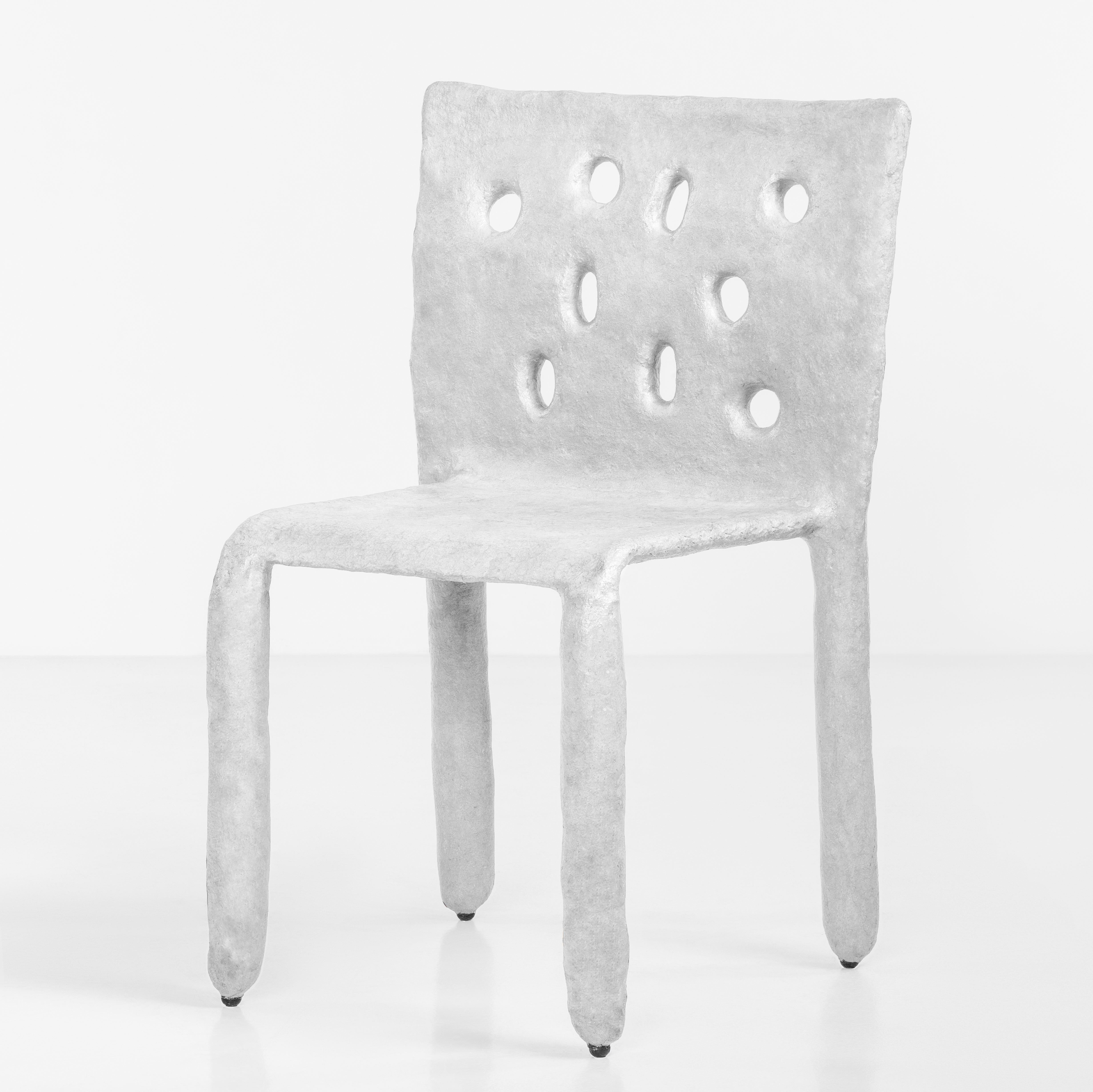 Sculpted Outdoor contemporary chair by FAINA
Design: Victoriya Yakusha
Material: steel, flax rubber, biopolymer, cellulose
Dimensions: Height 82 x width 54 x legs depth 45 cm
 Weight: 15 kilos.

Made in the style of ethnic minimalism, the