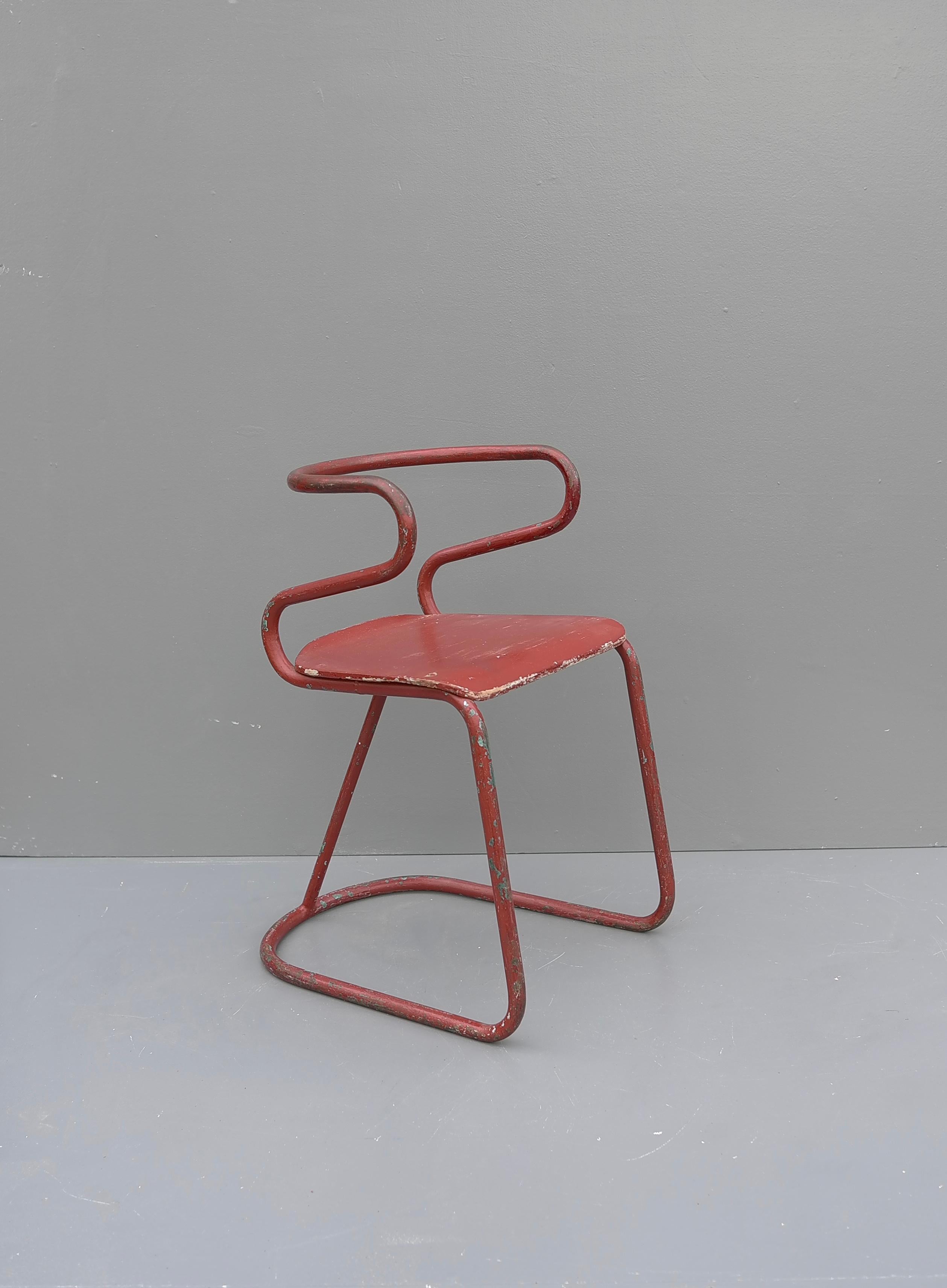 European Red Sculptural Tubular Steel and Wood Mid-Century Modern Children Chair, 1950's For Sale