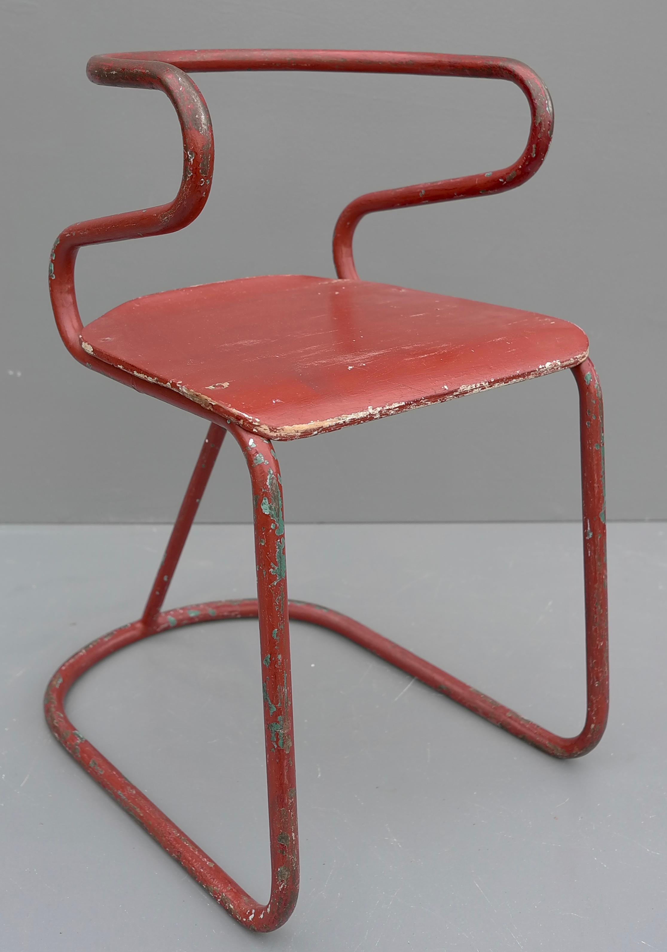 European Red Sculptural Tubular Steel and Wood Mid-Century Modern Children Chair, 1950's For Sale