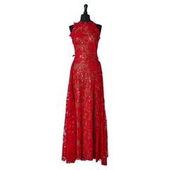 Red sequins embroideries evening dress with over-skirt on the back Marc Bouwer 