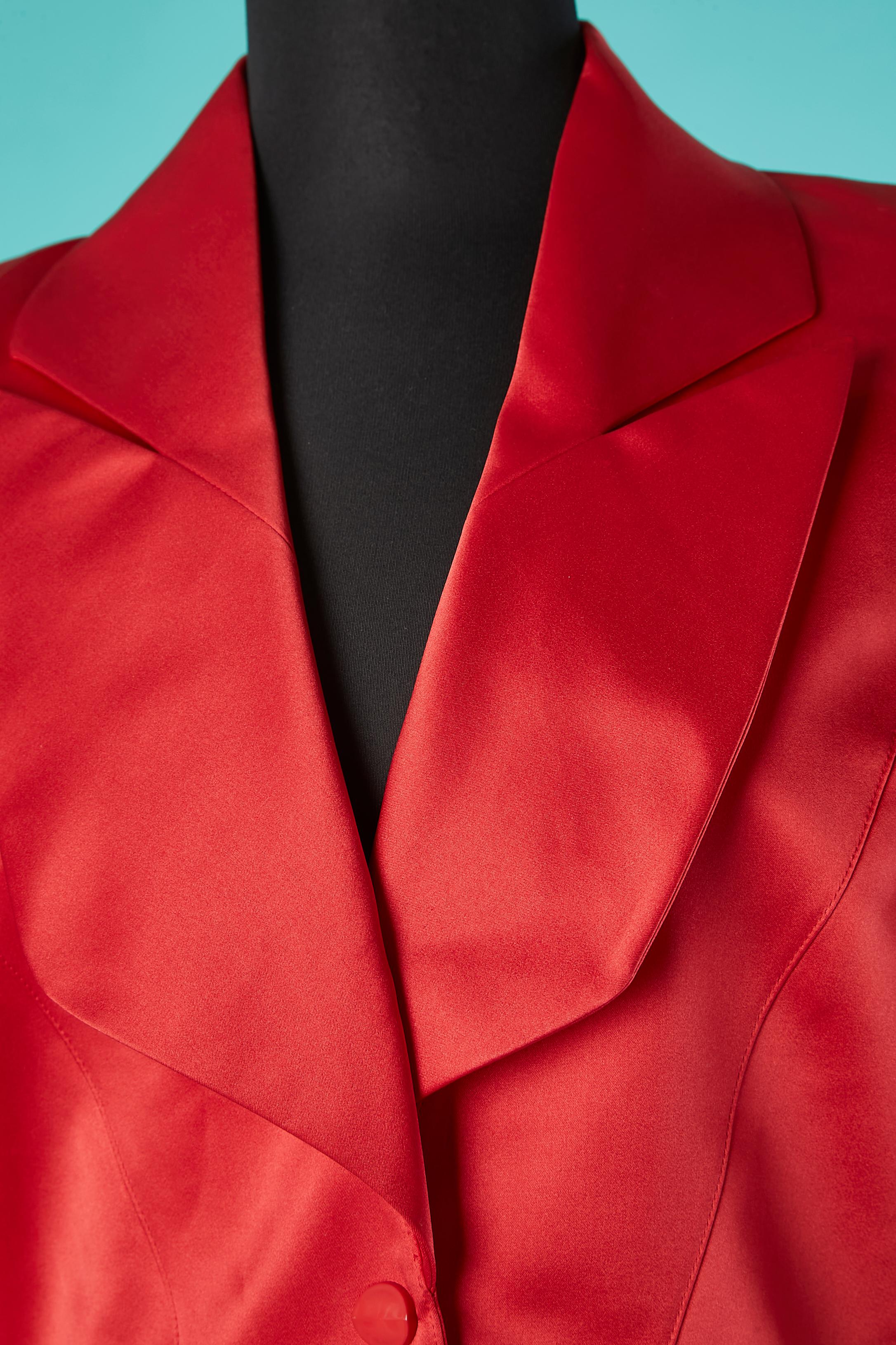 Red silk satin skirt -suit. Main fabric: 51% silk, 49% acetate. 
No fabric composition tag for the lining but probably looks like satin. 
Shoulder-pads. Snap closure in the middle front + one hidden button and buttonhole at the bottom end of the