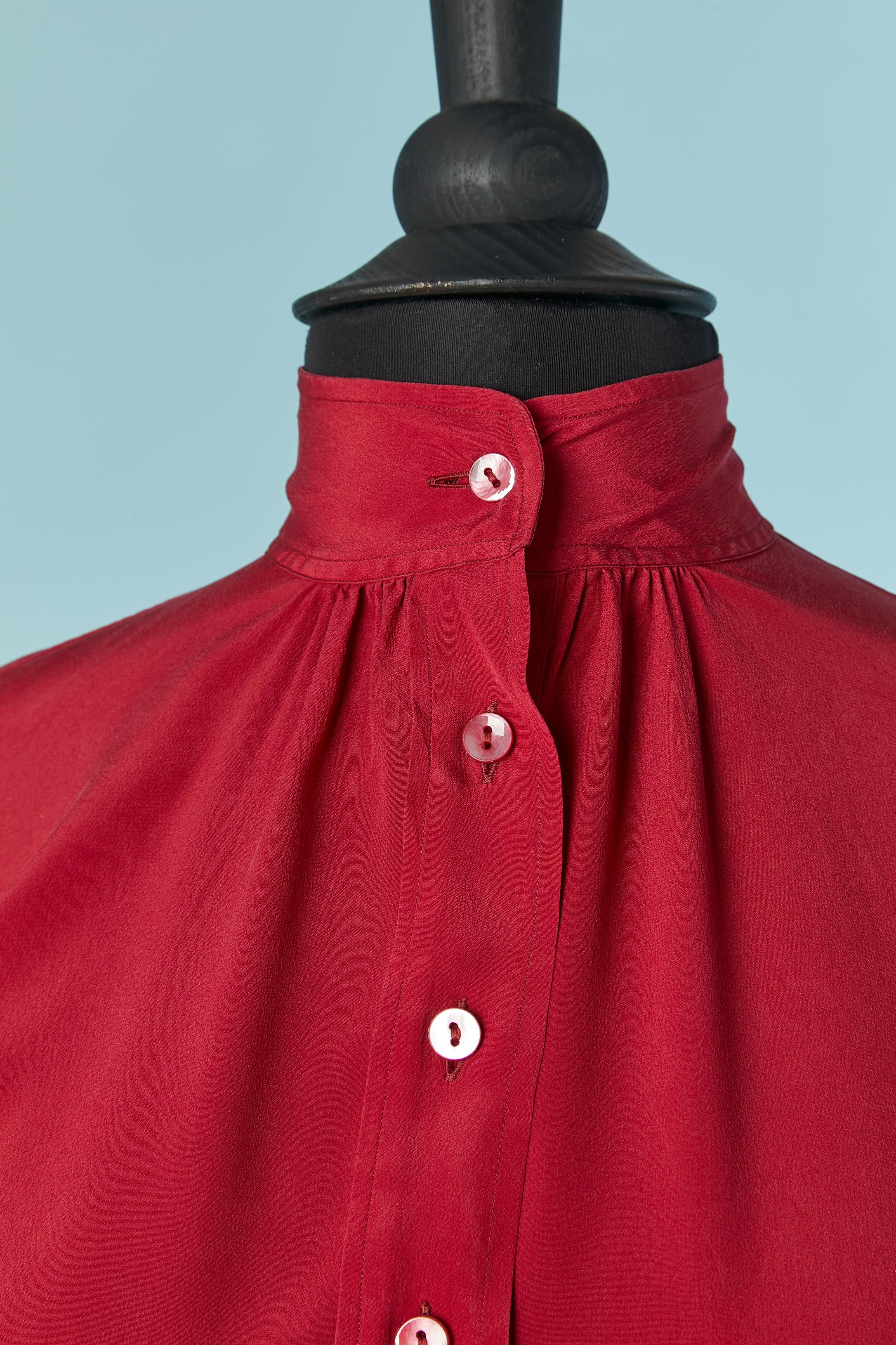 Red silk shirt with button and button on the top middle front and on cuffs. 
SIZE 36 (Fr) S 