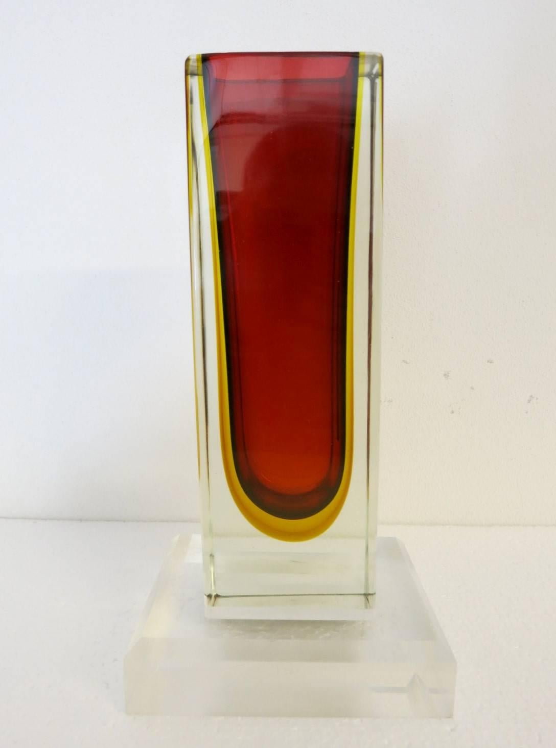 Vintage Italian faceted red Murano glass vase blown in Sommerso technique on lucite base 
Designed by Mandruzzato circa 1960's / Made in Italy 
Vase Dimensions:
Height: 11 inches / Width: 3.5 inches / Depth: 2.5 inches
Lucite Base Dimensions:
Depth: