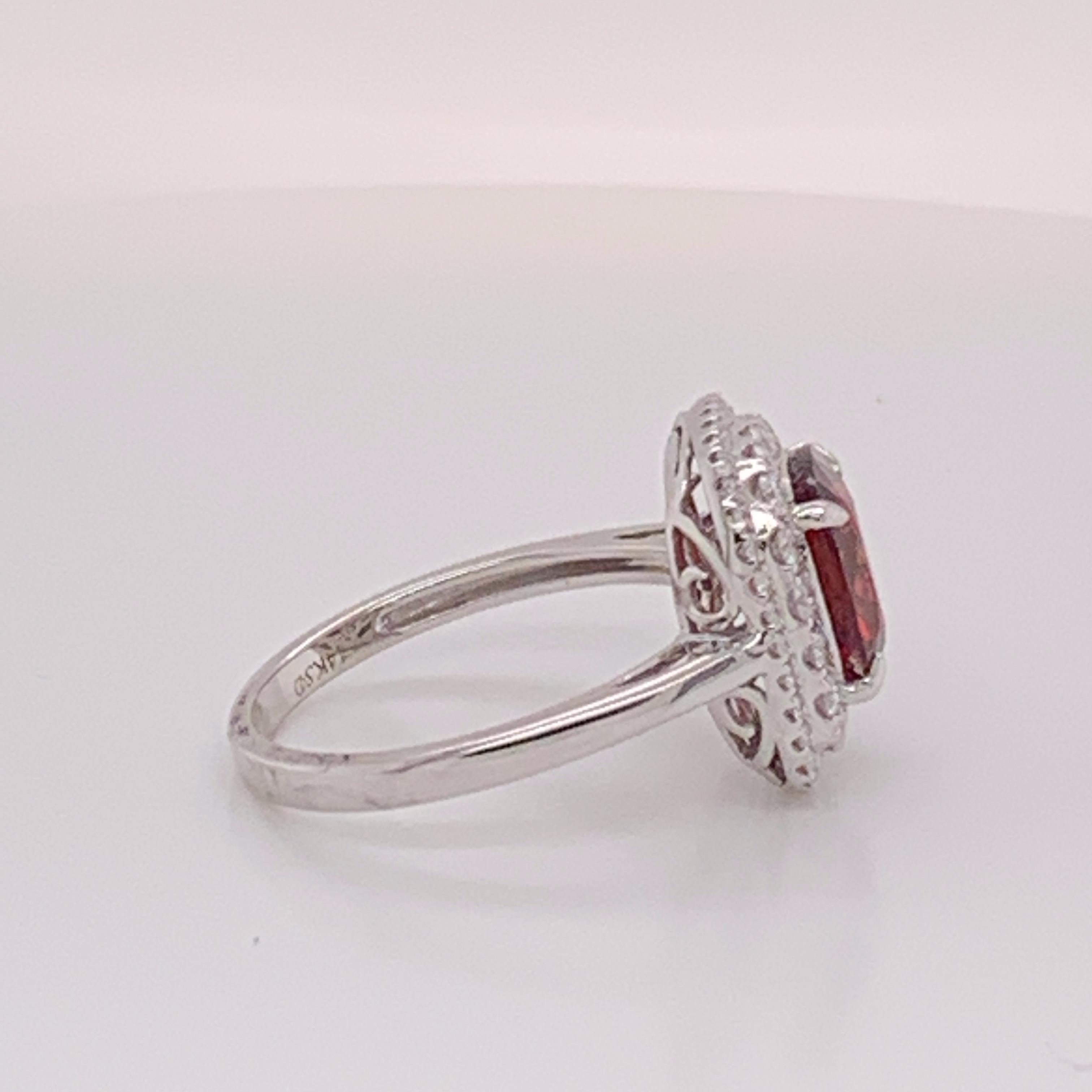 Natural cushion shape Red spinal 2.77 carat and white round diamonds 0.47 carat set in 14 Karat white gold is one of a kind handcrafted Ring. The size of the ring is 7 but can be resized if needed.