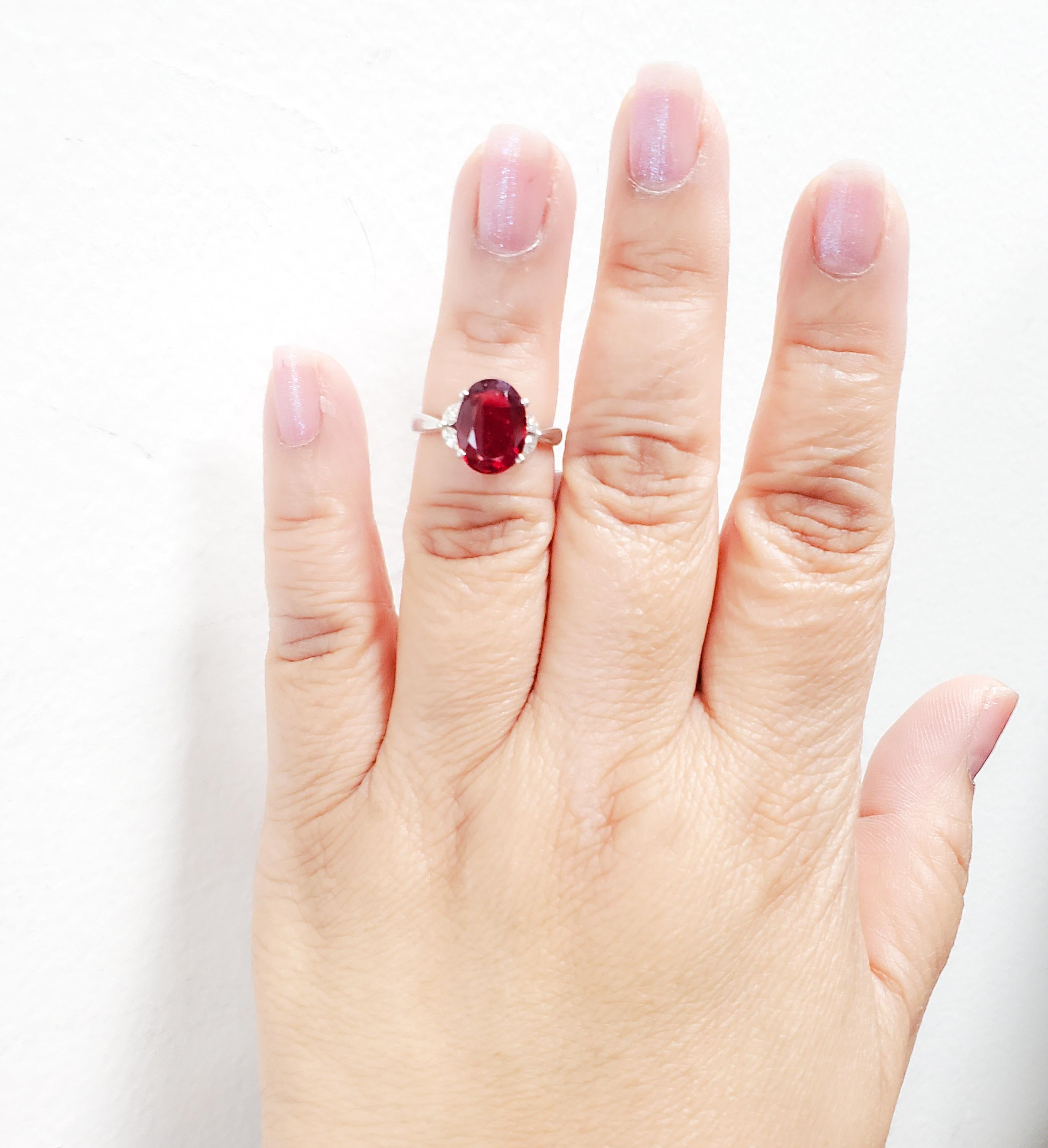 Beautiful 3.55 ct. red spinel oval with 0.23 ct. white diamond marquise shapes.  Handmade in platinum.  Ring size 6.25.