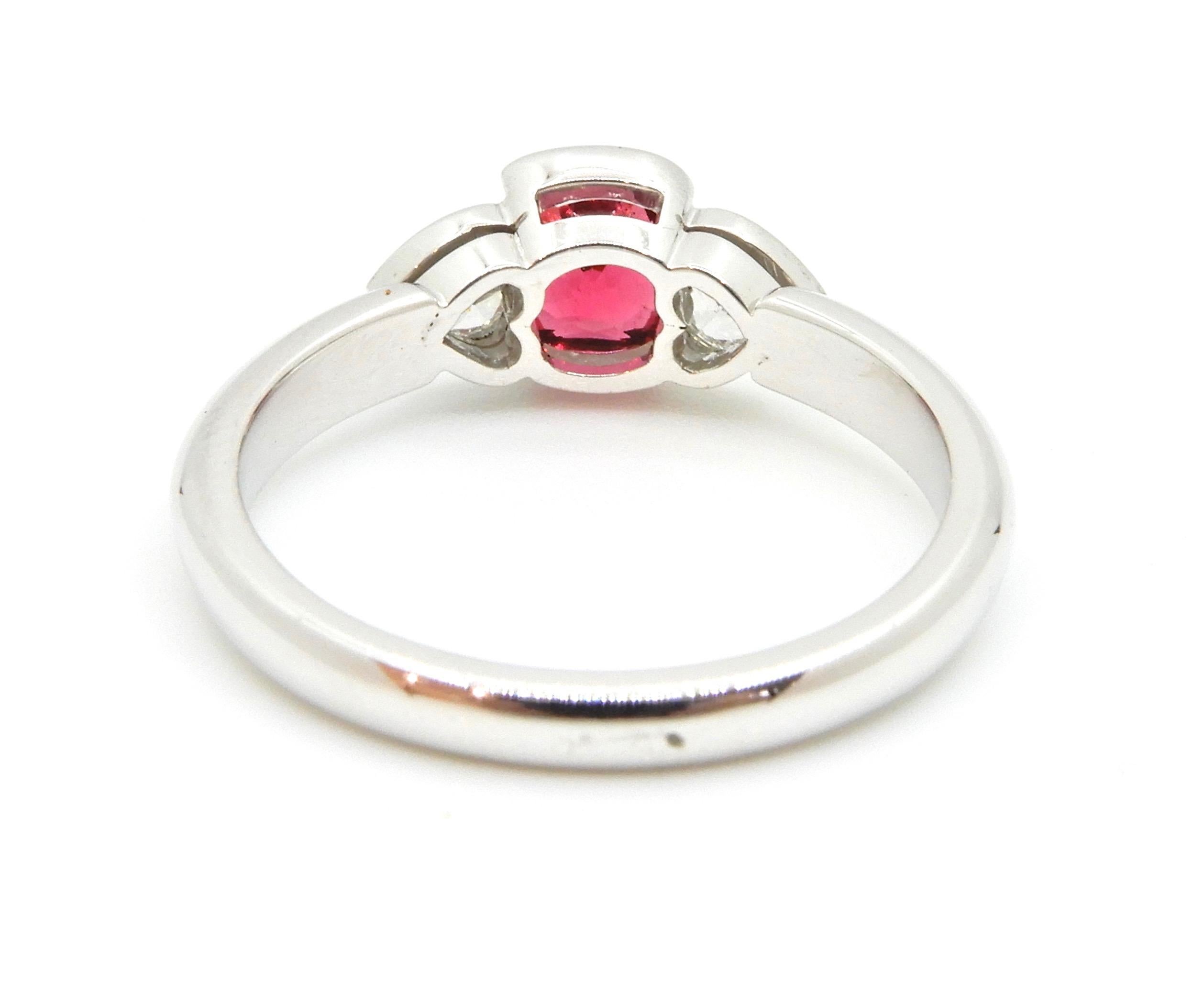 white gold ring with red stone