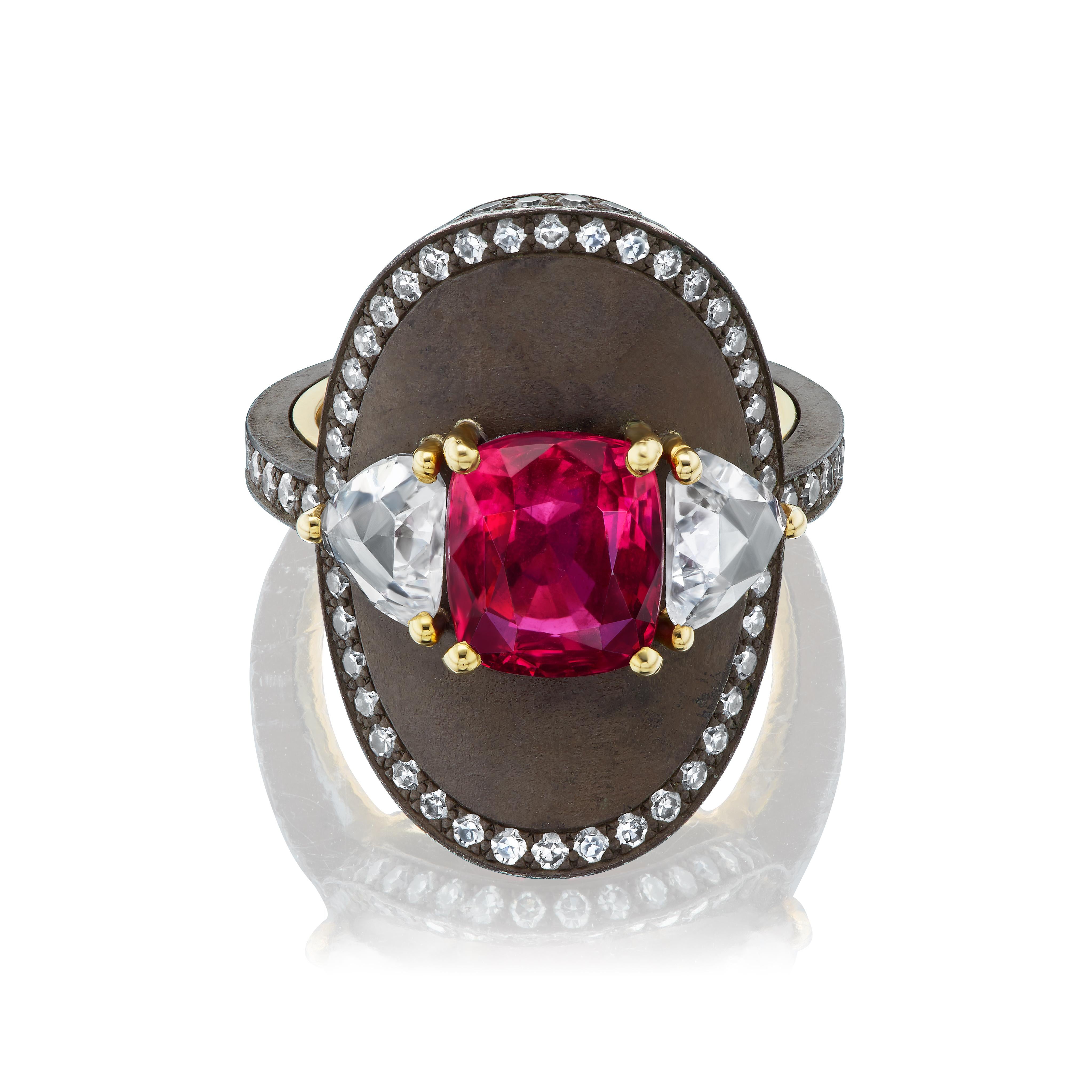 Made by a very fine French atelier that prefers to remain anonymous, this exquisite ring features a vivid red cushion cut red spinel from Tanzania (4.36cts) and a wonderful pair of antique cut diamonds (2 triangles 1.24cts total weight).  The