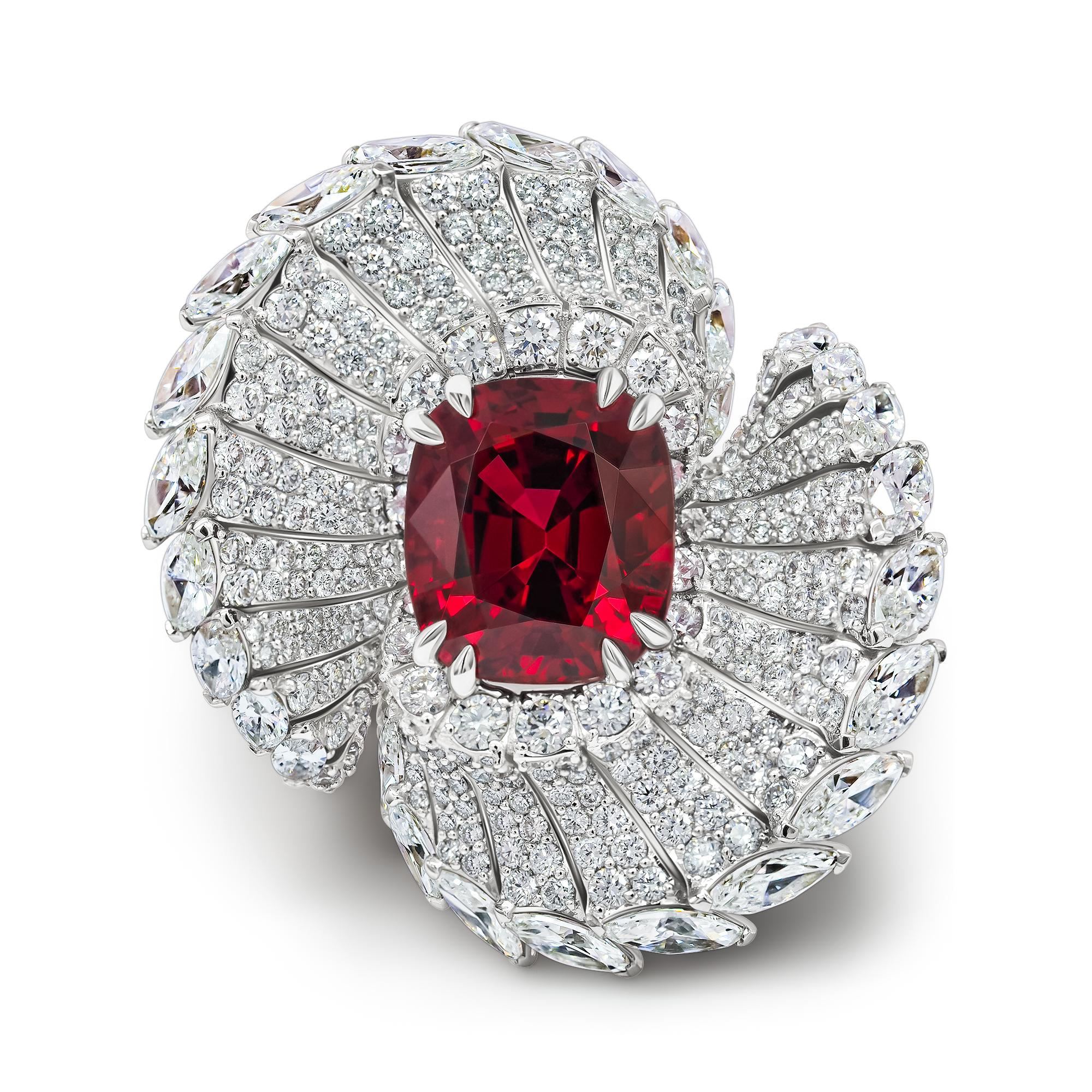 FIRE BIRD RED SPINEL RING 
from our Magic Garden collection. 

•	18K White gold.  
•	Red Spinel in cushion cut – total carat weight 5.09. 
•	Diamonds – 28 pc in marquise cut, total carat weight 2.82.
•	Diamonds – 466 pc in round cut – total carat