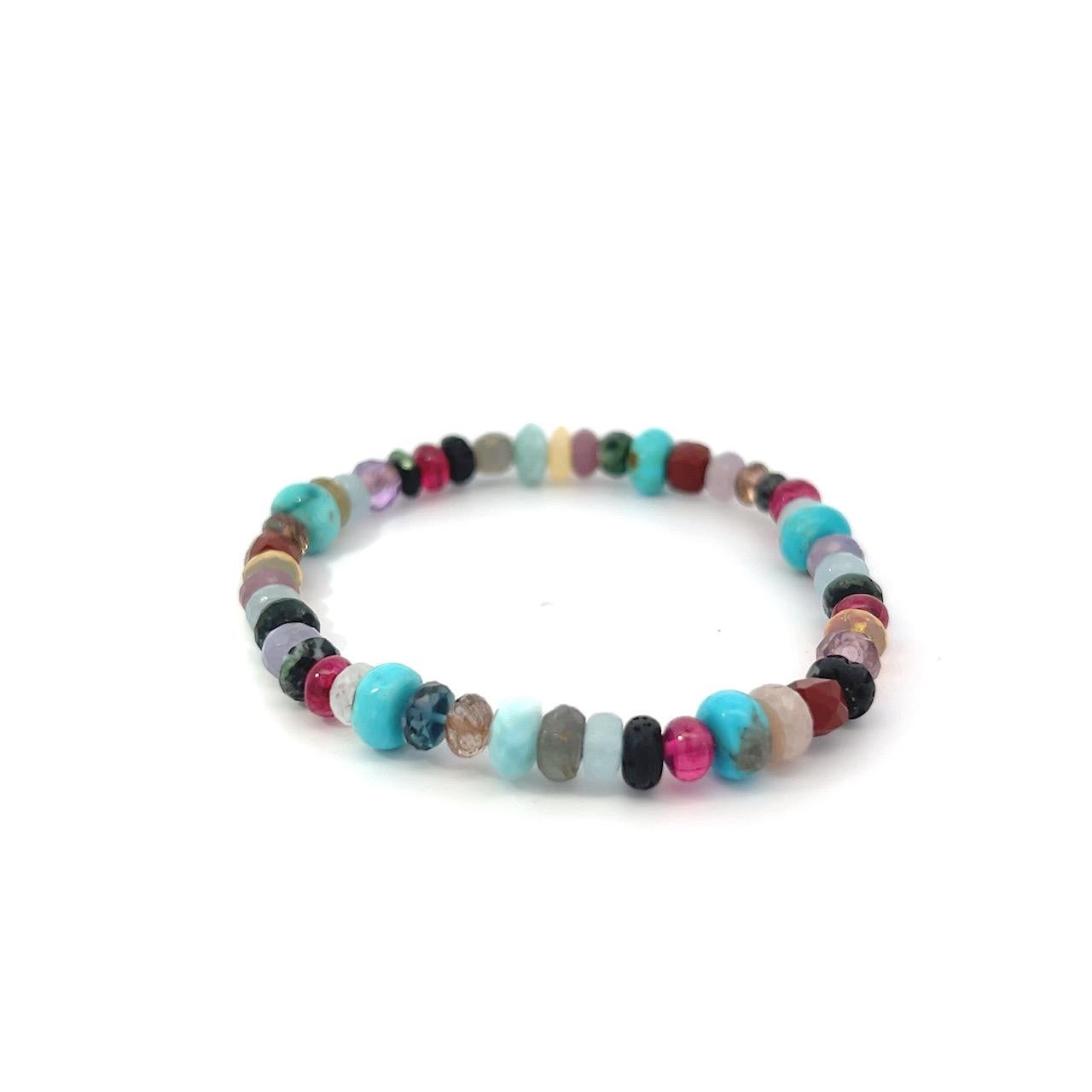 This stunning 7.75” stretch bracelet is a vibrant fusion of natural gemstones, featuring approximately 6.5 total carats of red spinel. Each bead is carefully selected to create a harmonious blend of color and energy, including red spinel, turquoise,