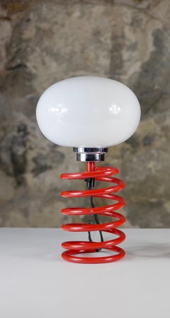 Red spring table lamp attributed to Ingo Maurer, 1970s