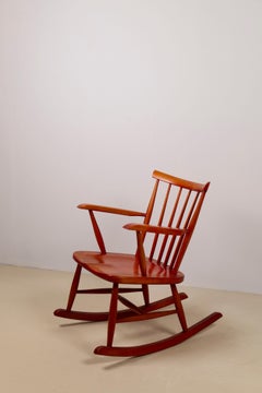 Red stained beech rocking chair, Pastoe, Netherlands 1960's