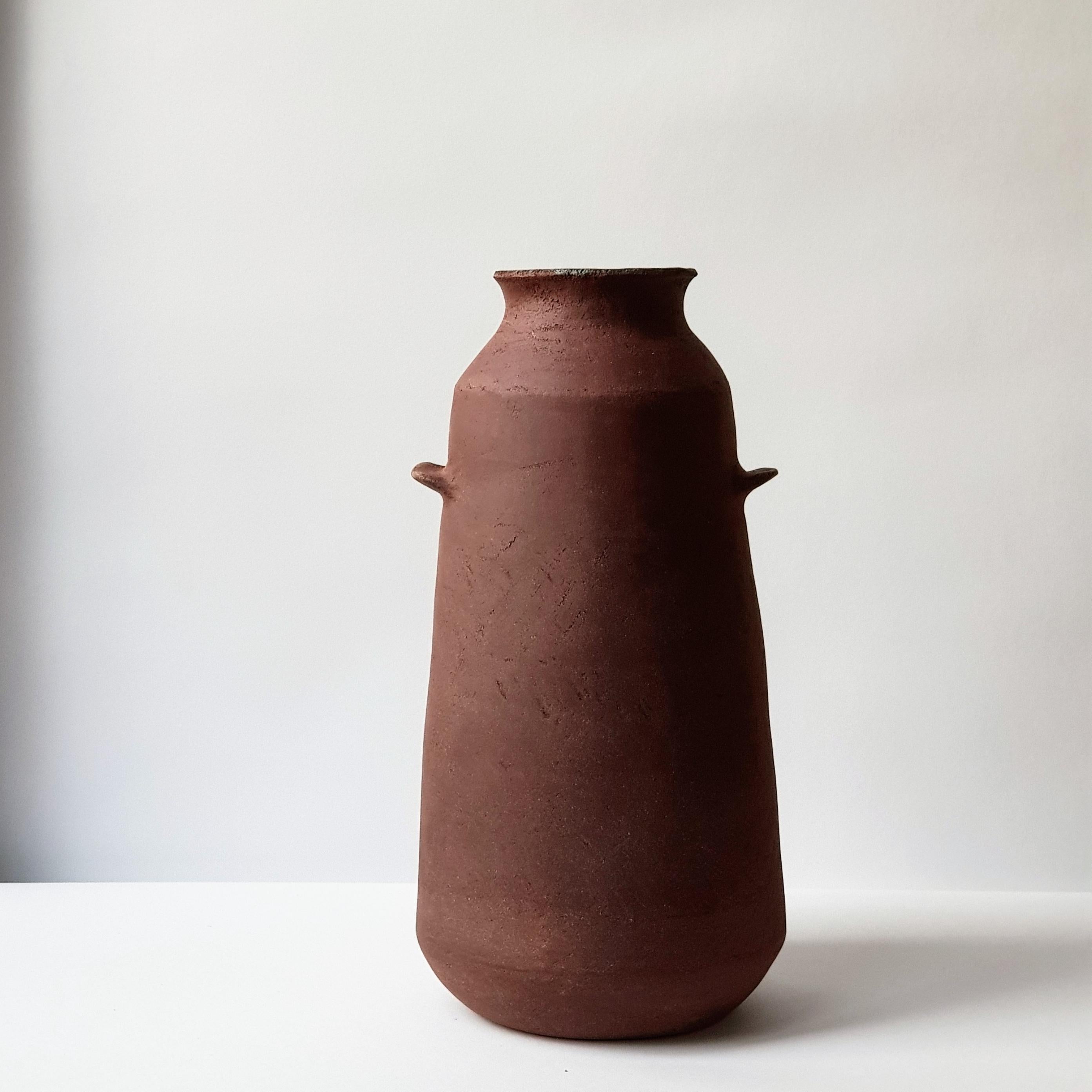 Red Stoneware Alavastron Vase by Elena Vasilantonaki
Unique
Dimensions: ⌀ 20 x H 40 cm (Dimensions may vary)
Materials: Stoneware
Available finishes: White, Red, Black, Brown, Black, White Patina

Growing up in Greece I was surrounded by pottery