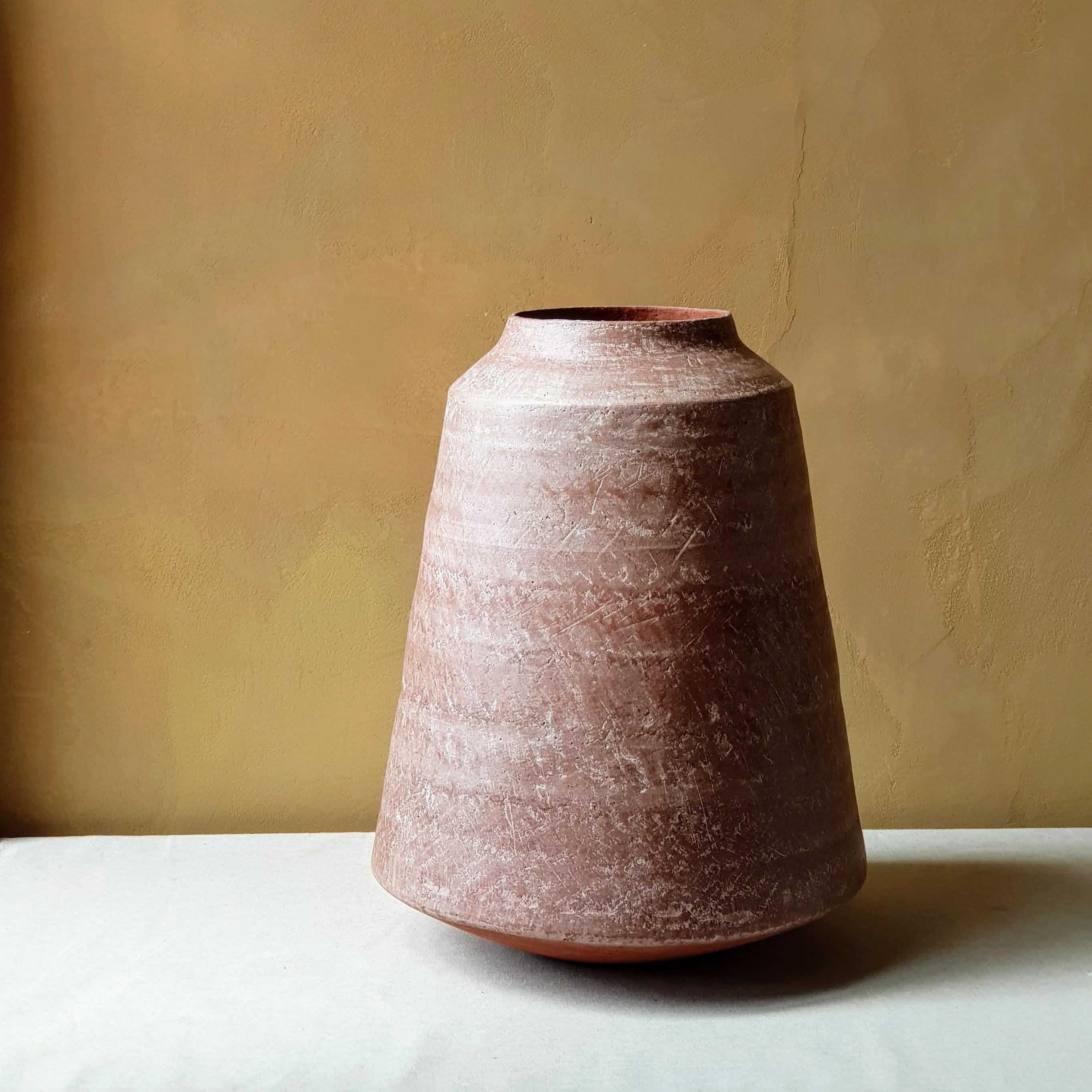 Red Stoneware Kados Vase by Elena Vasilantonaki
Unique
Dimensions: ⌀ 30 x H 25 cm (Dimensions may vary)
Materials: Stoneware
Available finishes: Black, White, Grey, Brown, Red, White Patina

Growing up in Greece I was surrounded by pottery forms