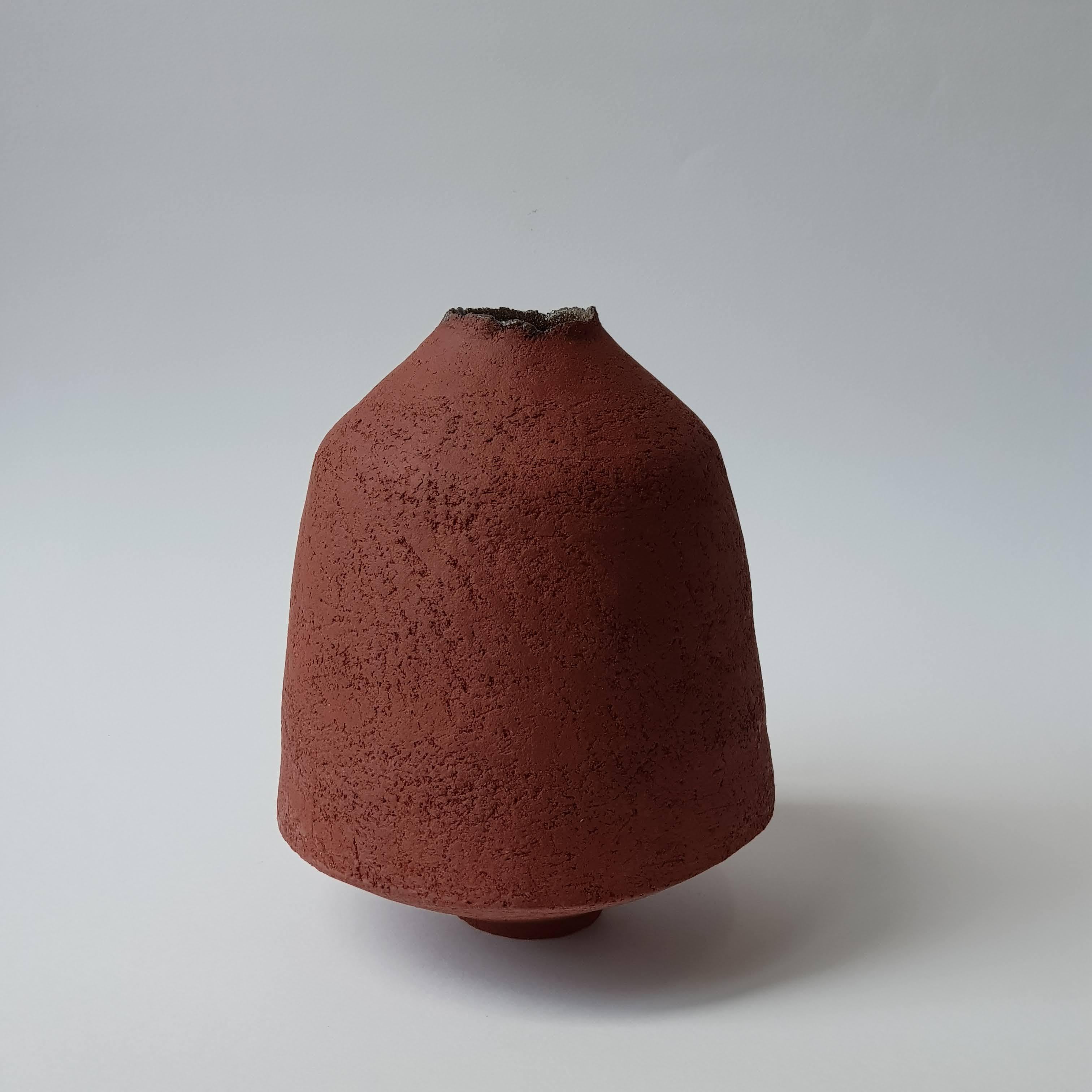 Red Stoneware Pithos Vase by Elena Vasilantonaki
Unique
Dimensions: ⌀ 19 x H 24 cm (Dimensions may vary)
Materials: Stoneware
Available finishes: Black, White, Brown, Red, White Patina

Growing up in Greece I was surrounded by pottery forms that
