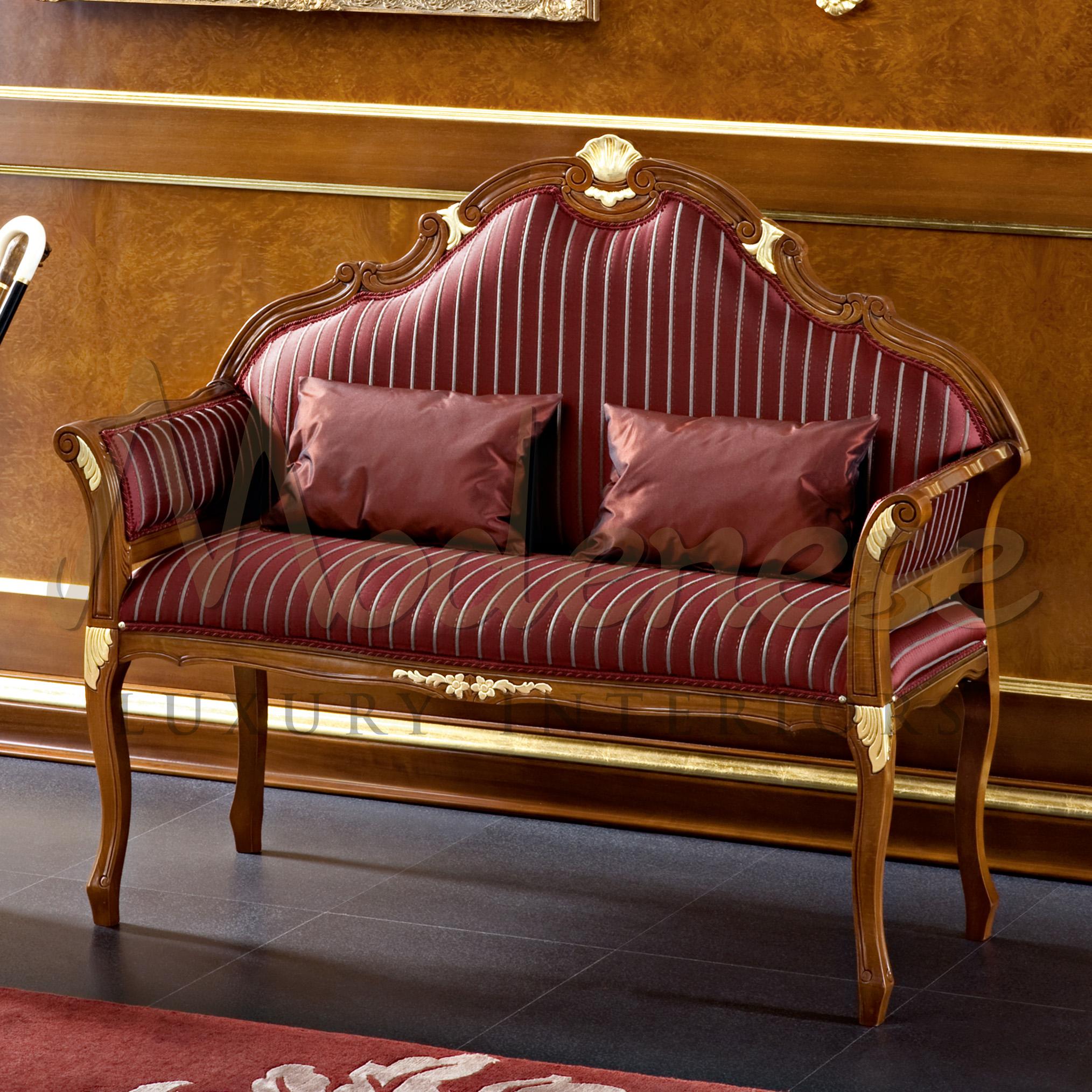 Add a classic touch to your private mansion living areas with this slim and lovely two-seater loveseat by Modenese Luxury Interiors, showing up in one of our baroque catalogues. It features a natural walnut finish with gold applications on the