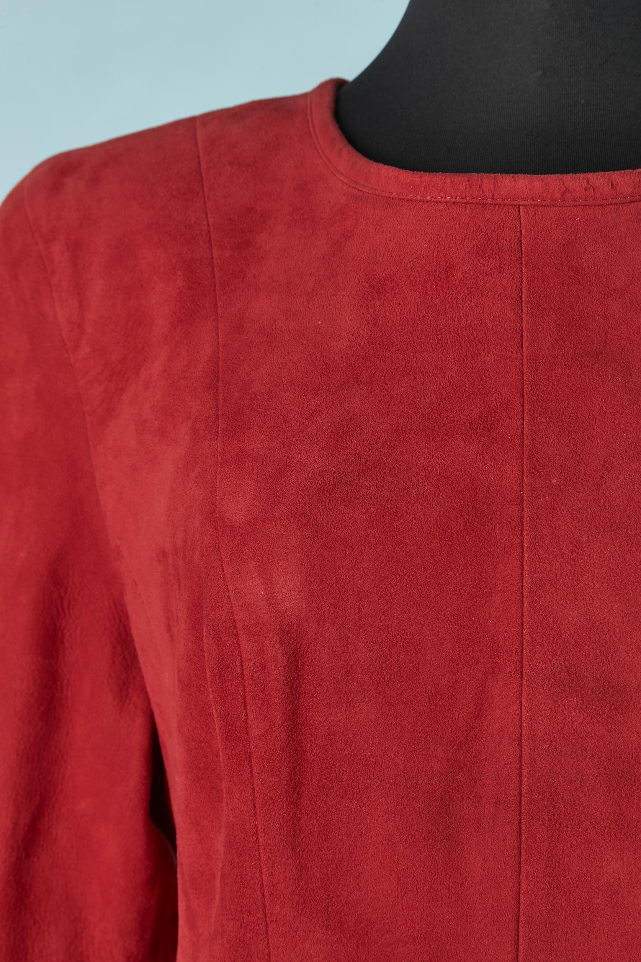 Red suede dress with long sleeves and open in the back. Suede is made of genuine leather and lining composition is rayon. 
One snap closure on the top middle back and zip in the middle back. 
SIZE 7/8 (US) L 