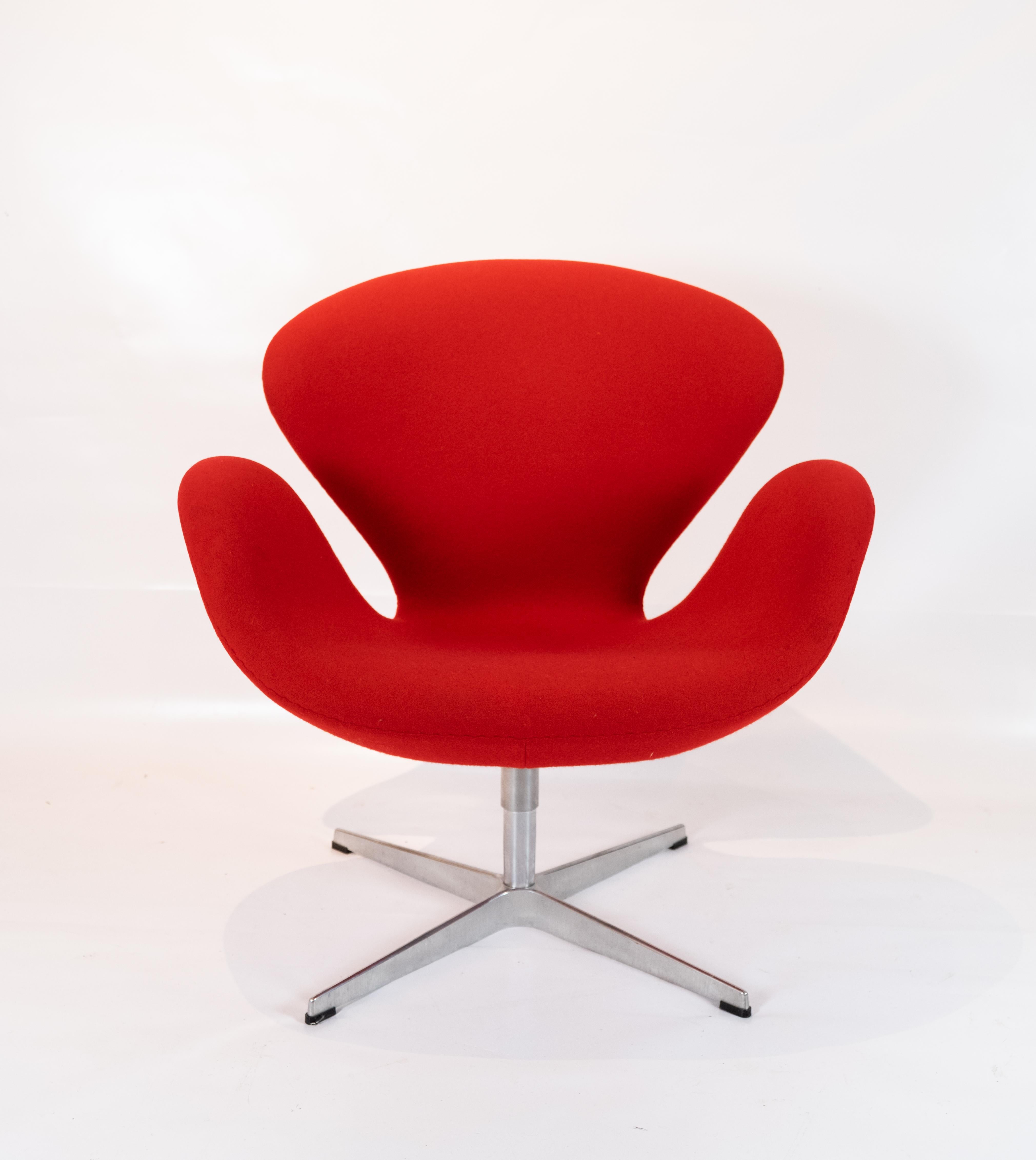 The Swan chair, model 3320, designed by Arne Jacobsen in 1958 and manufactured by Fritz Hansen. The chair is upholstered with red Hallingdal fabric.