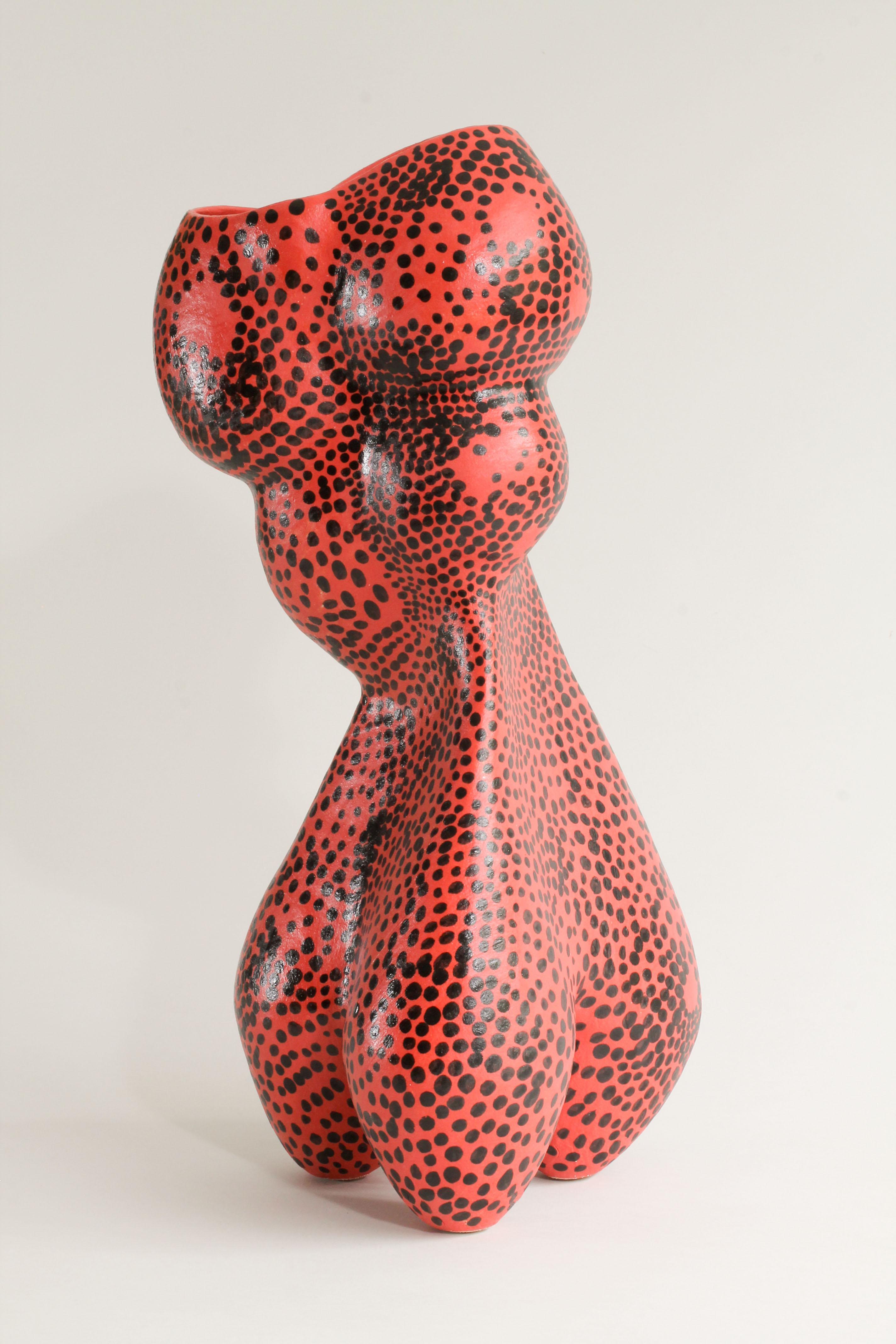Red Swarm was made by hand using the ancient technique of coiling with ropes of clay.  I use stoneware clay which in this instance has then been decorated with liquid red porcelain and black underglaze.  
Rather than imposing a fixed visual