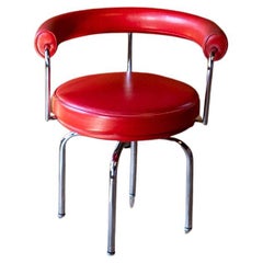 Red Swivel Armchair "LC7" by Charlotte Perriand, Italy
