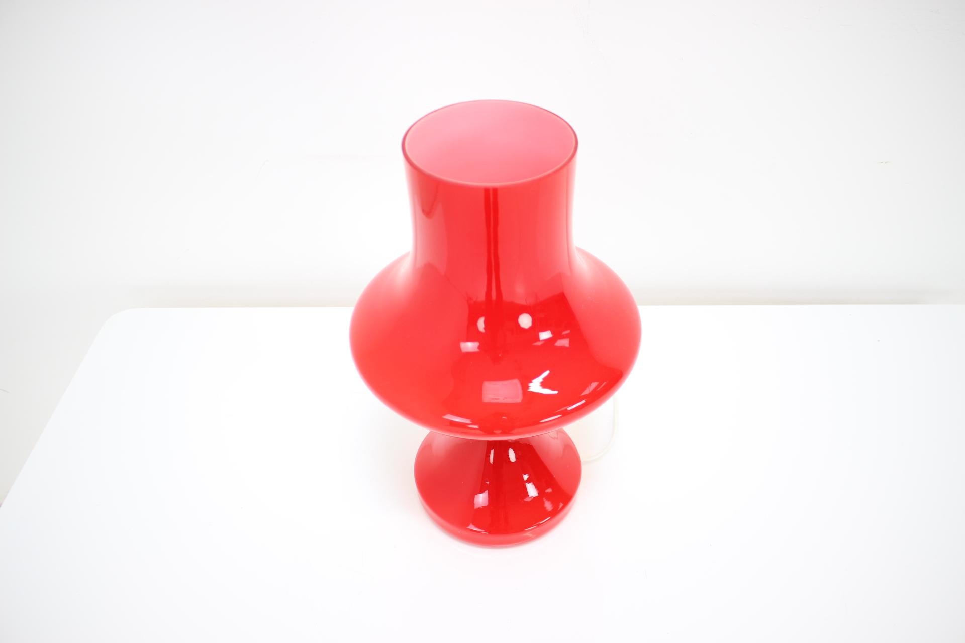 Red glass table lamp designed by Stepan Tabera for Czechoslovakian company OPP Jihlava in early 1970s. Two layers of glass - white inside and red outside. 
1x60W, E25-E27 bulb
US plug adapter included.